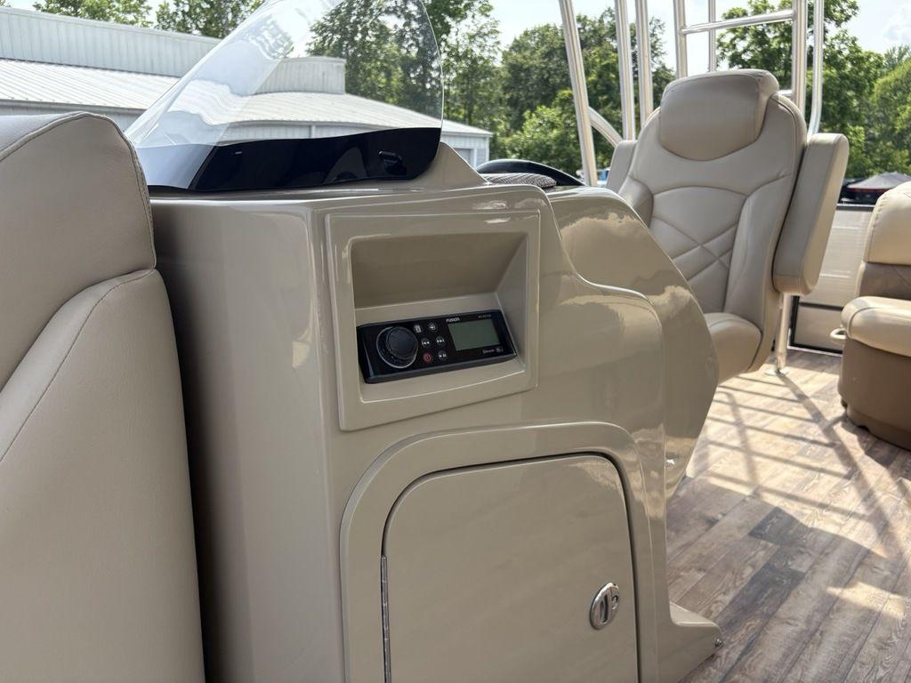 Interior of 2017 Crest Classic 250L USD CP3 boat with beige seating and control panel.
