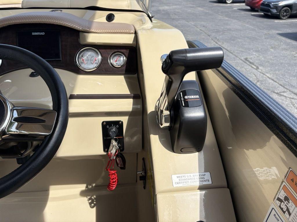 2017 Crest Classic 250L boat dashboard with Yamaha throttle and Simrad display.