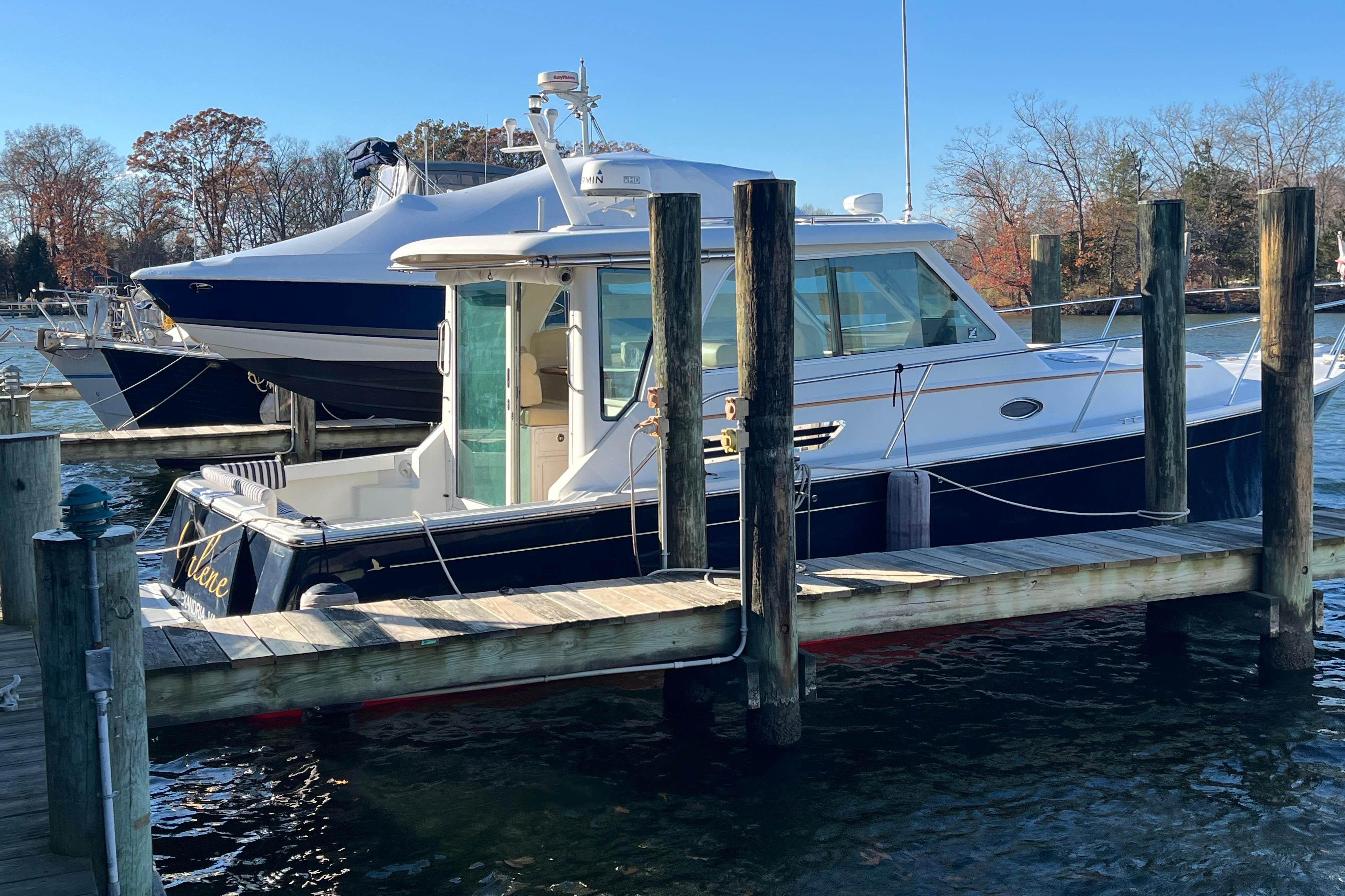 2010 Back Cove 33 Express Hardtop docked at marina on a sunny day.