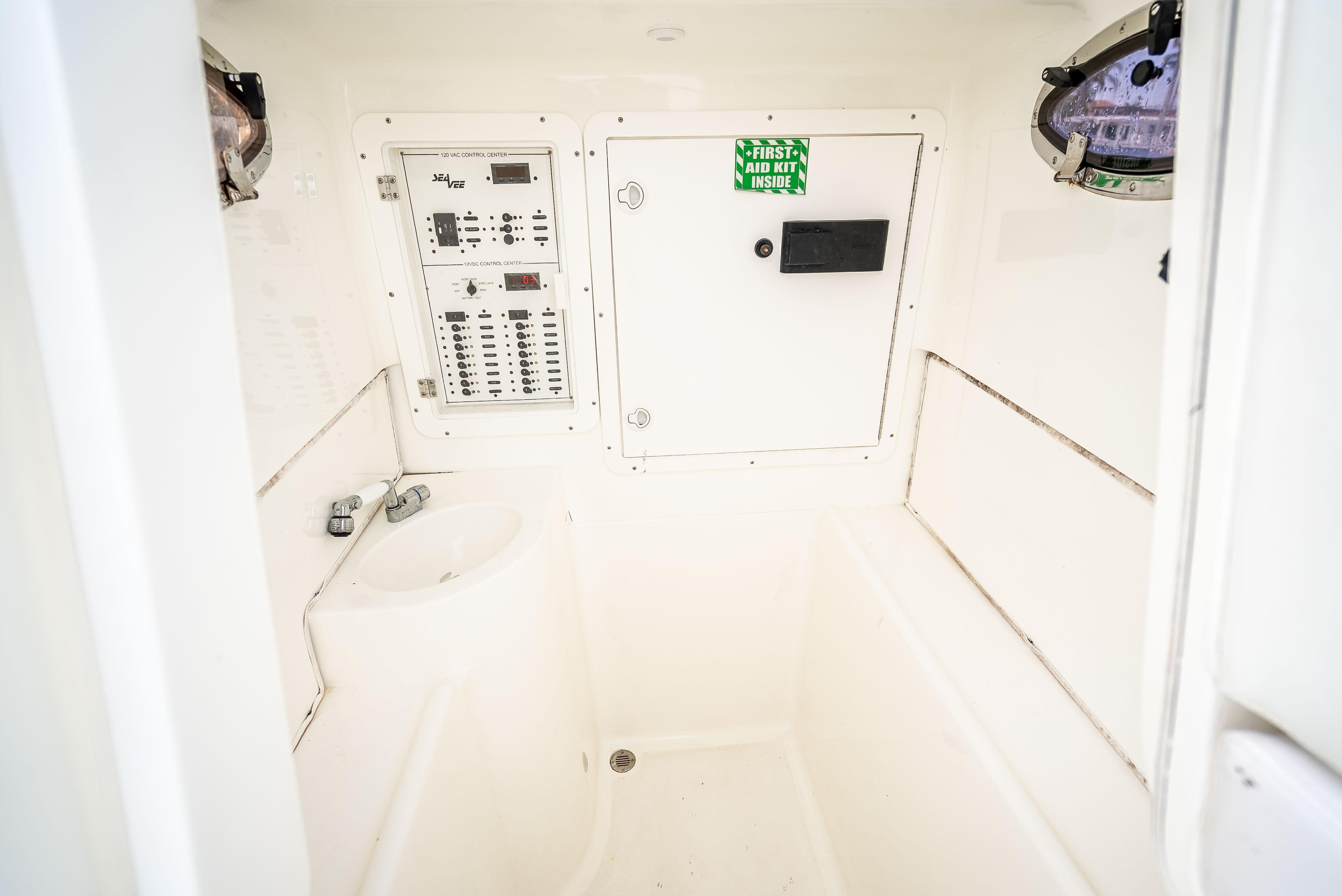 SeaVee-34 2014 -FL-US-2014 SeaVee 34 interior with control panel and sink, featuring white minimalist design.-9825396 | Thumbnail
