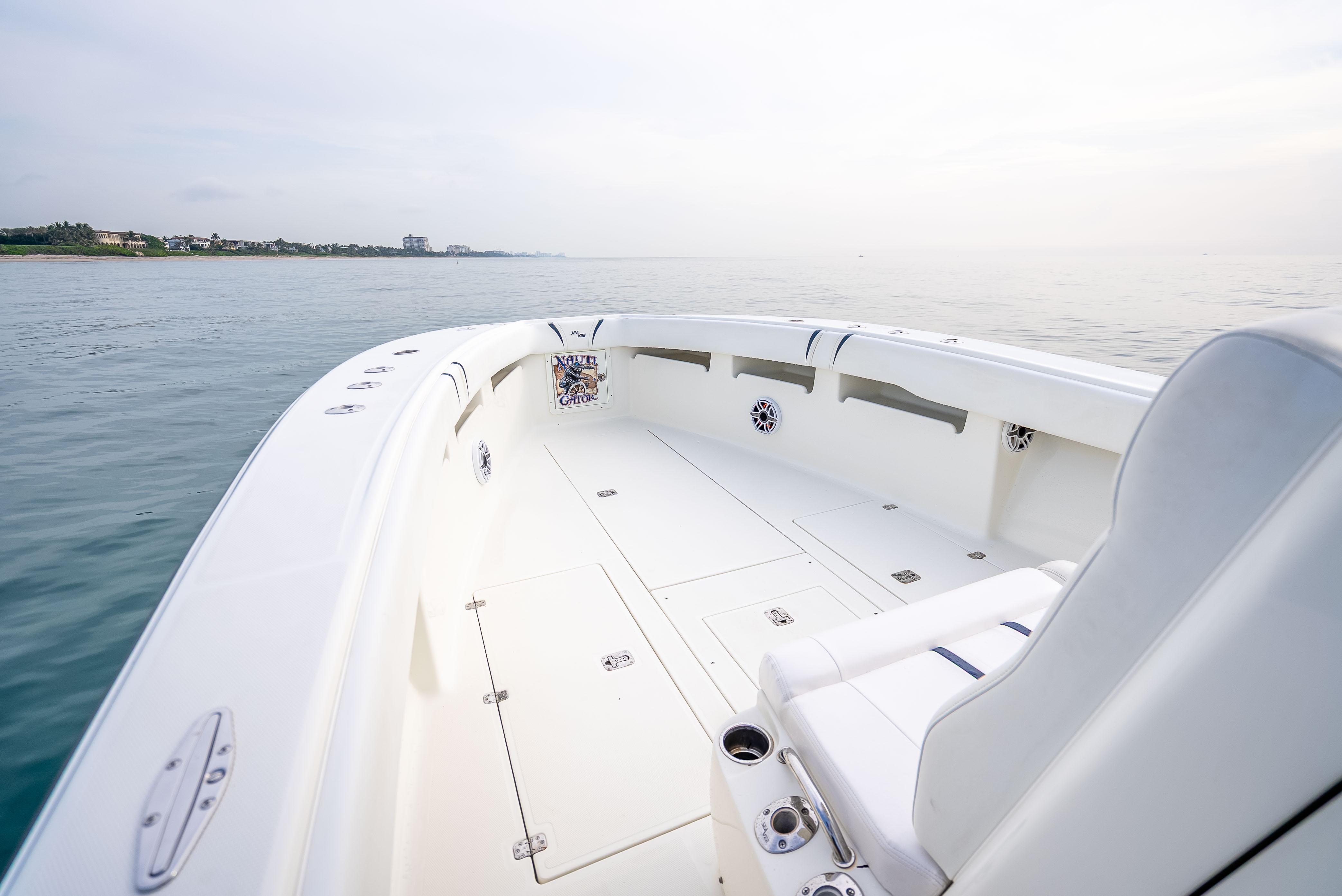 SeaVee-34 2014 -FL-US-2014 SeaVee 34 boat on calm water, featuring spacious deck and seating.-9825396 | Thumbnail