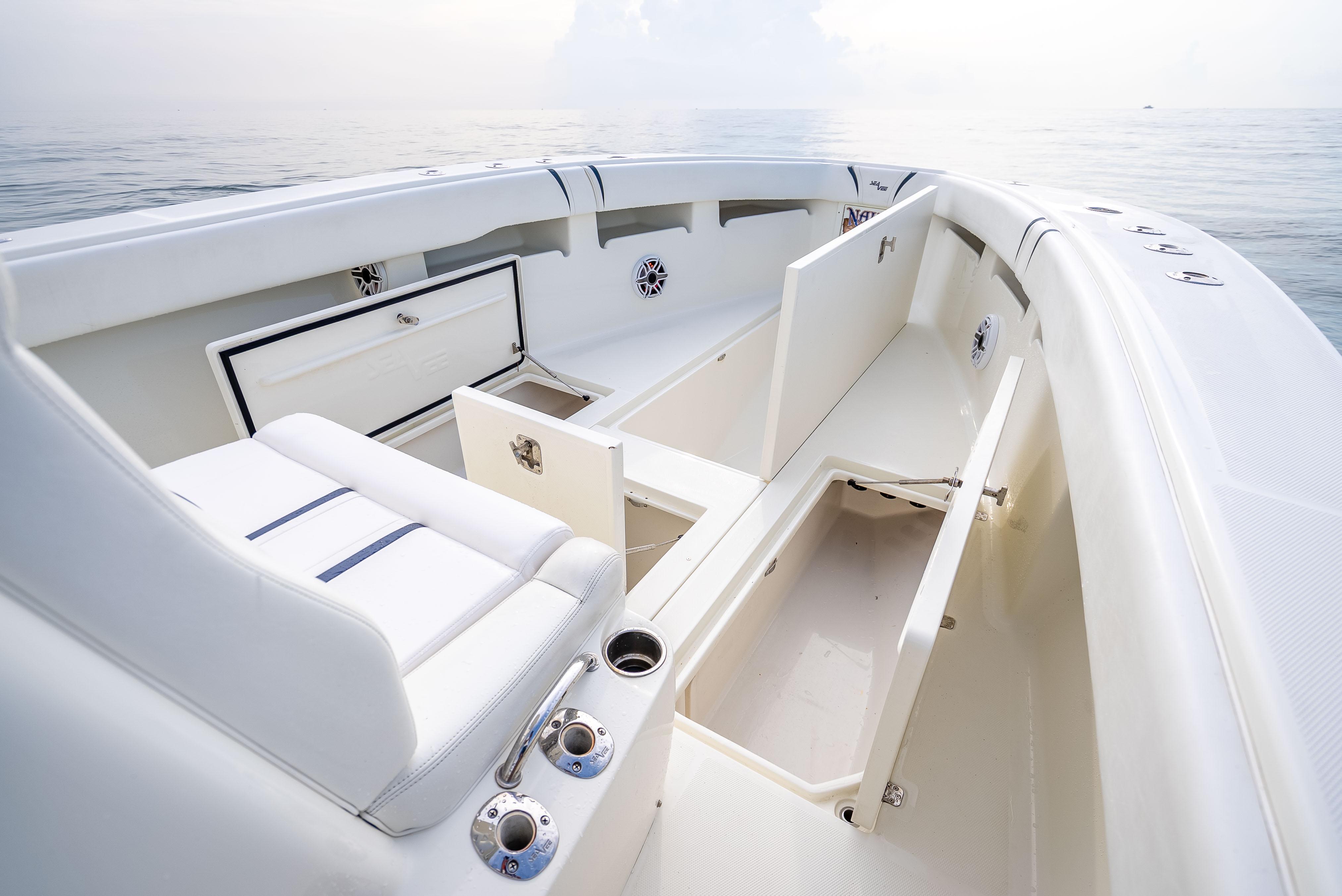 SeaVee-34 2014 -FL-US-2014 SeaVee 34 boat interior with white seating and storage compartments on calm water.-9825396 | Thumbnail