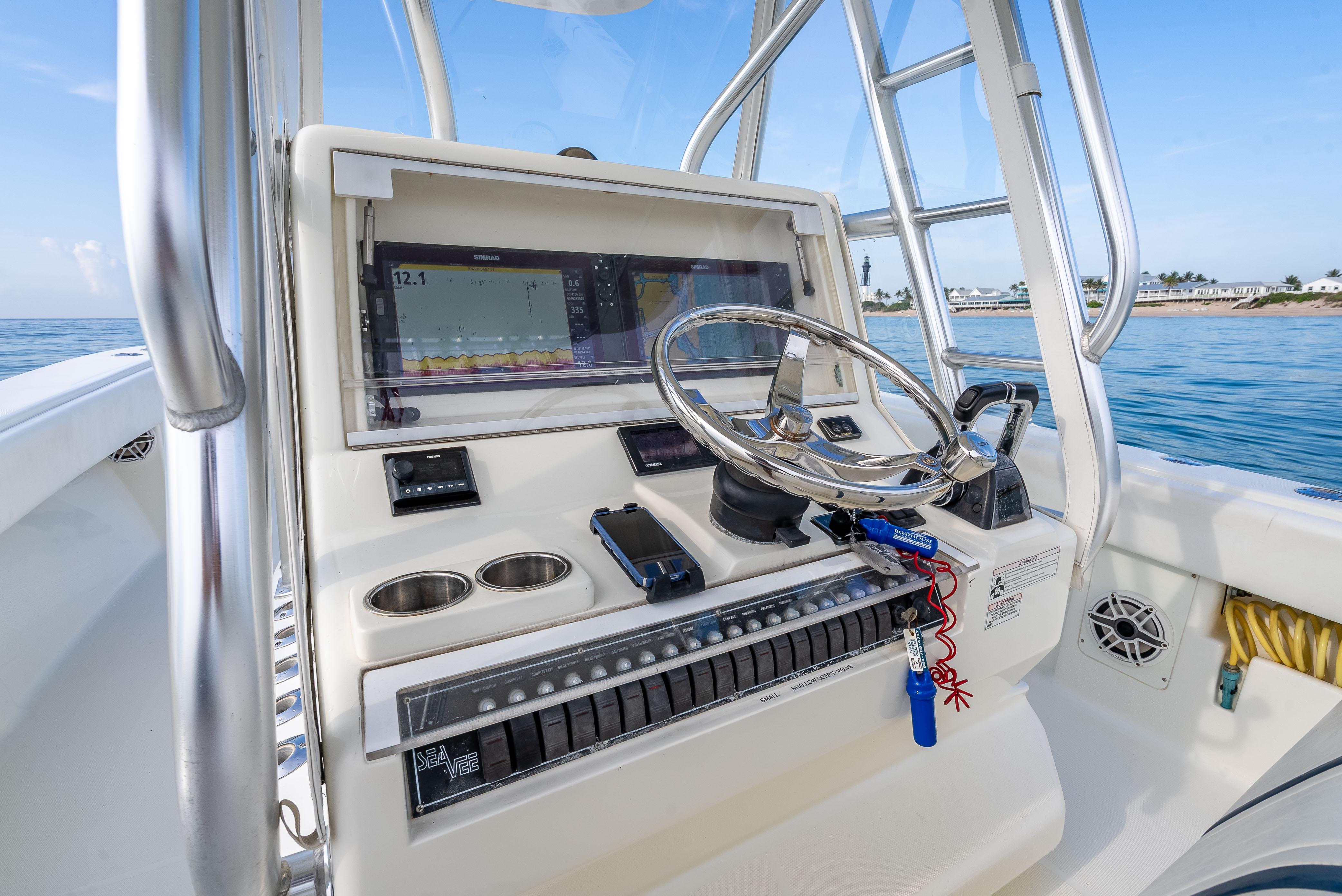 SeaVee-34 2014 -FL-US-2014 SeaVee 34 boat helm with steering wheel, navigation system, and ocean view.-9825396 | Thumbnail
