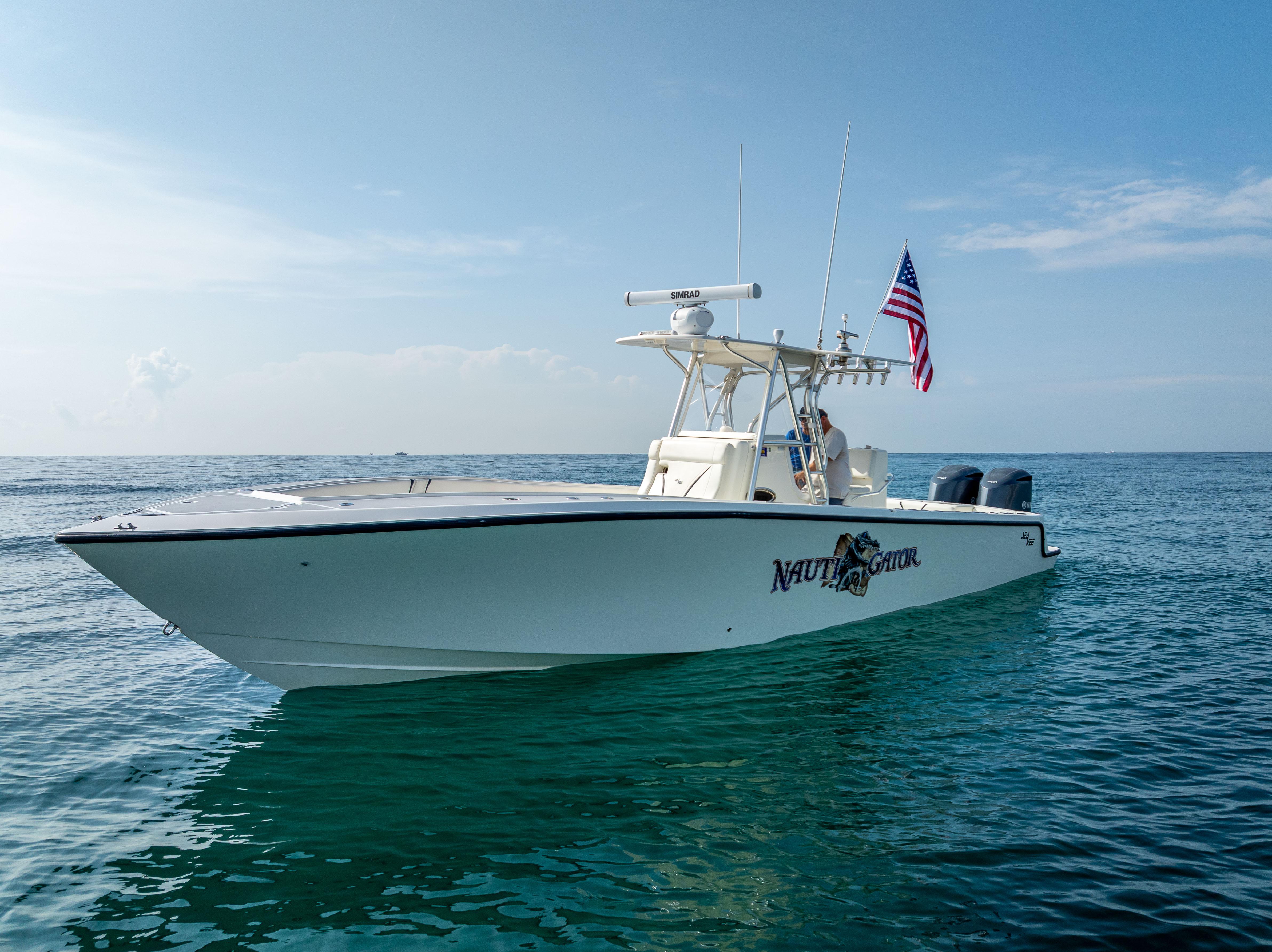 SeaVee-34 2014 -FL-US-2014 SeaVee 34 boat on calm ocean with American flag.-9825396