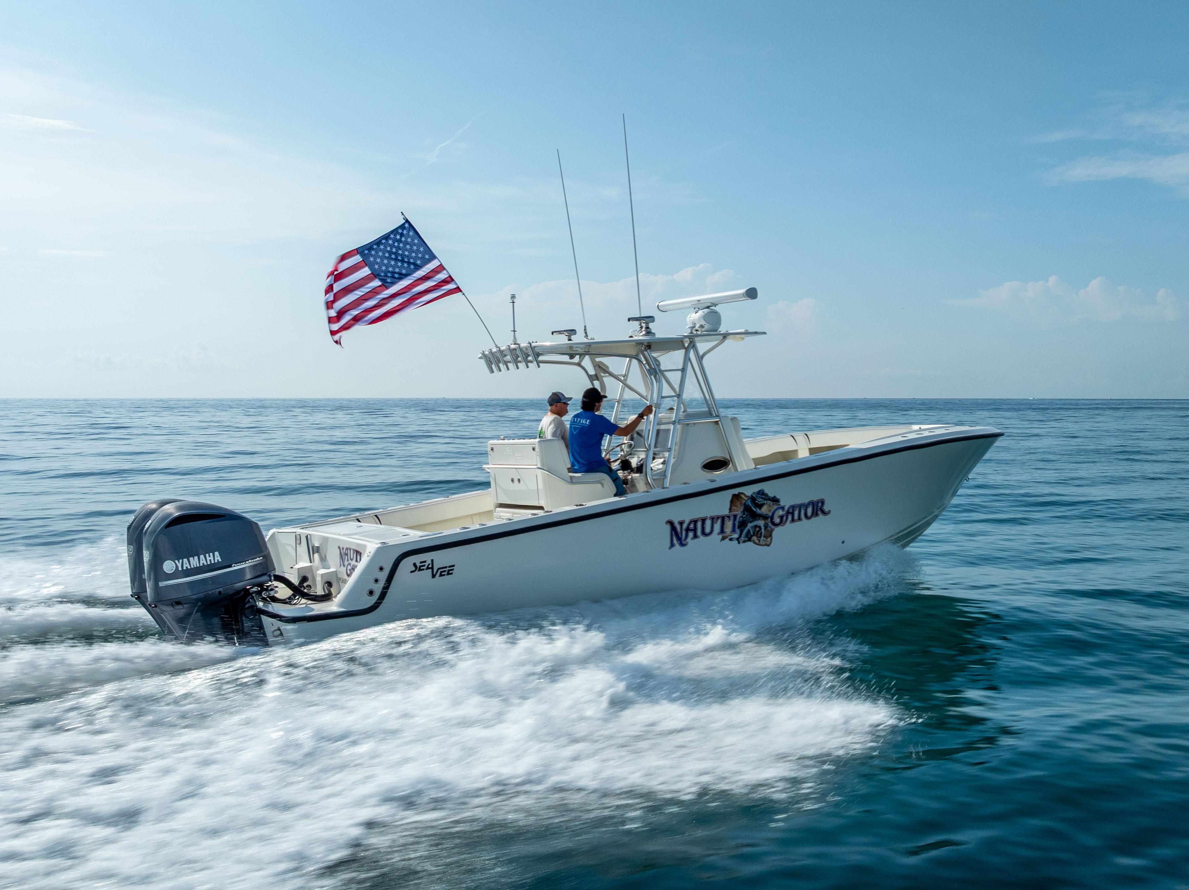 SeaVee-34 2014 -FL-US-2014 SeaVee 34 boat cruising on ocean with American flag and Yamaha engine.-9825396 | Thumbnail