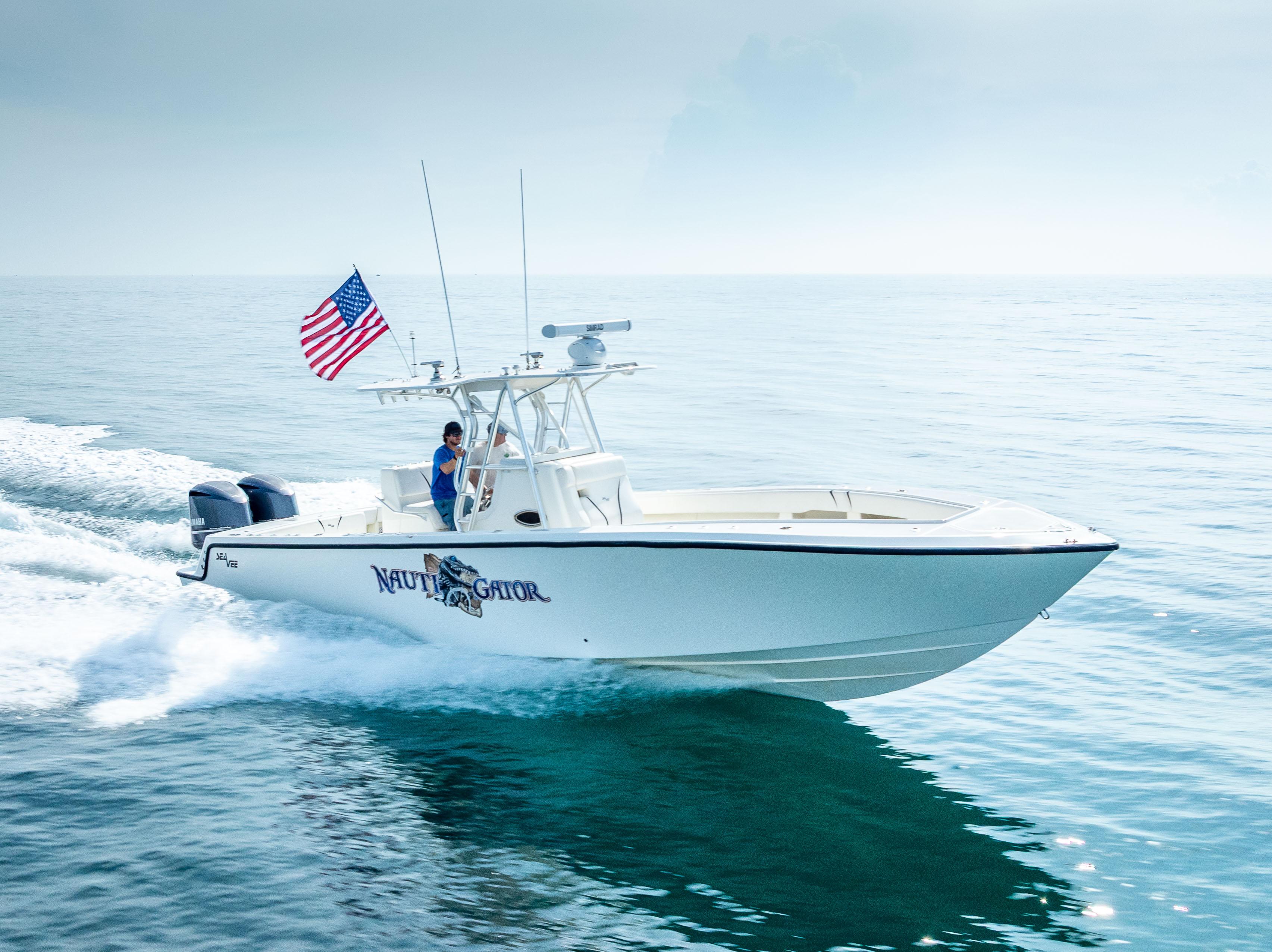 SeaVee-34 2014 -FL-US-2014 SeaVee 34 boat cruising on open water with American flag.-9825396 | Thumbnail