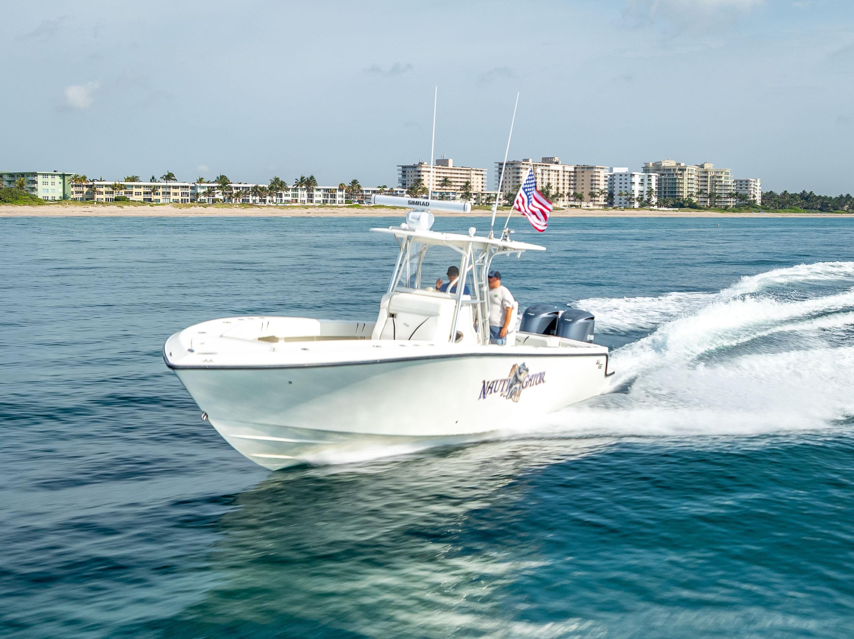 SeaVee-34 2014 -FL-US-2014 SeaVee 34 boat cruising on ocean near coastal buildings.-9825396 | Thumbnail