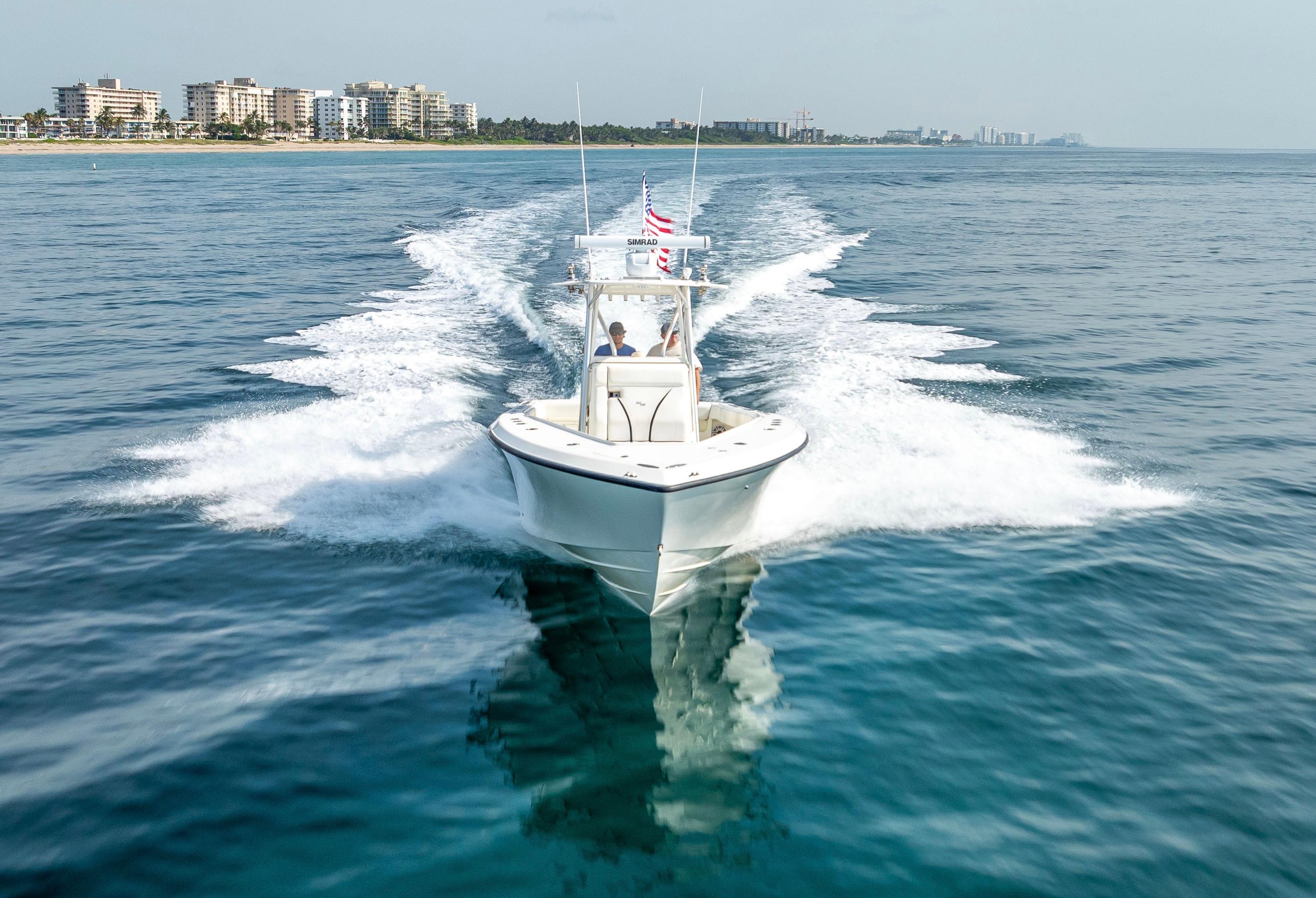SeaVee-34 2014 -FL-US-2014 SeaVee 34 boat cruising on open water near coastal cityscape.-9825396 | Thumbnail