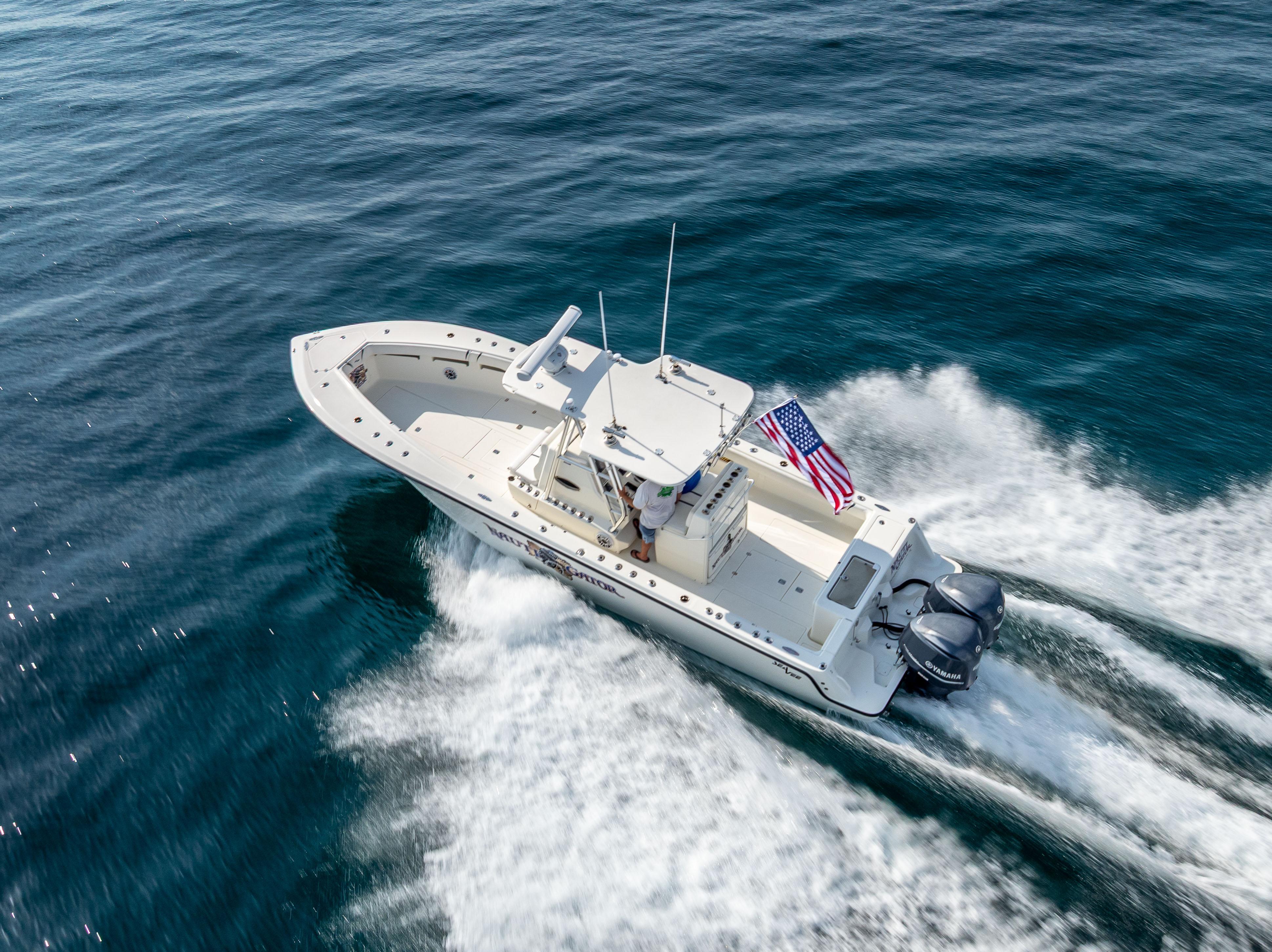 SeaVee-34 2014 -FL-US-2014 SeaVee 34 boat cruising on open water with American flag.-9825396 | Thumbnail