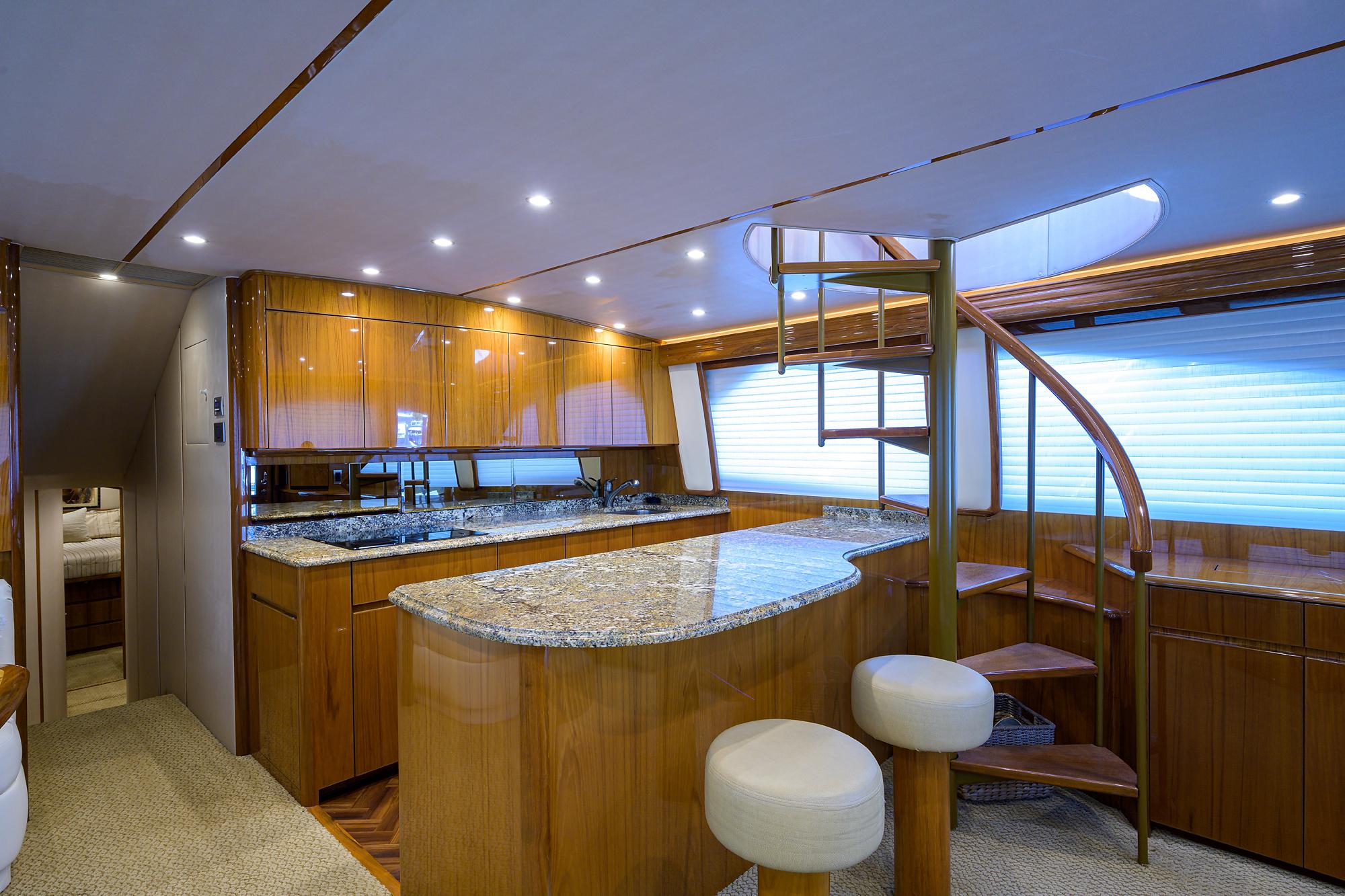 Viking 62 Chelsea - Stairwat to Enclosed Bridge, Galley with Counter Seating