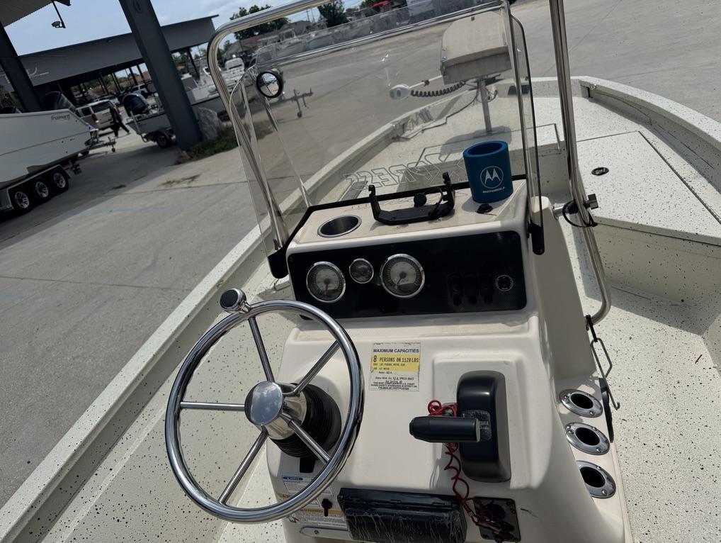 2013 Xpress Hyper-Lift Bay Series H22B boat console with steering wheel and controls.