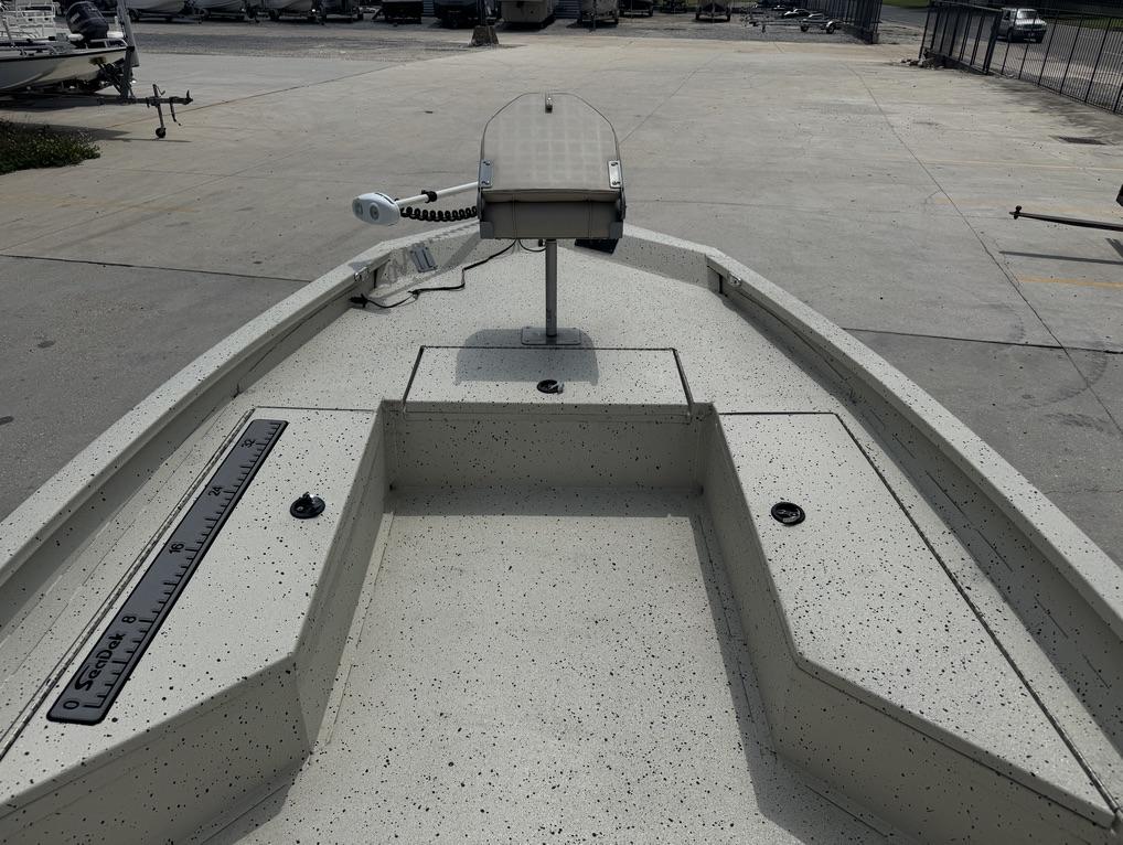 2013 Xpress Hyper-Lift Bay Series H22B boat deck with ruler and equipment.