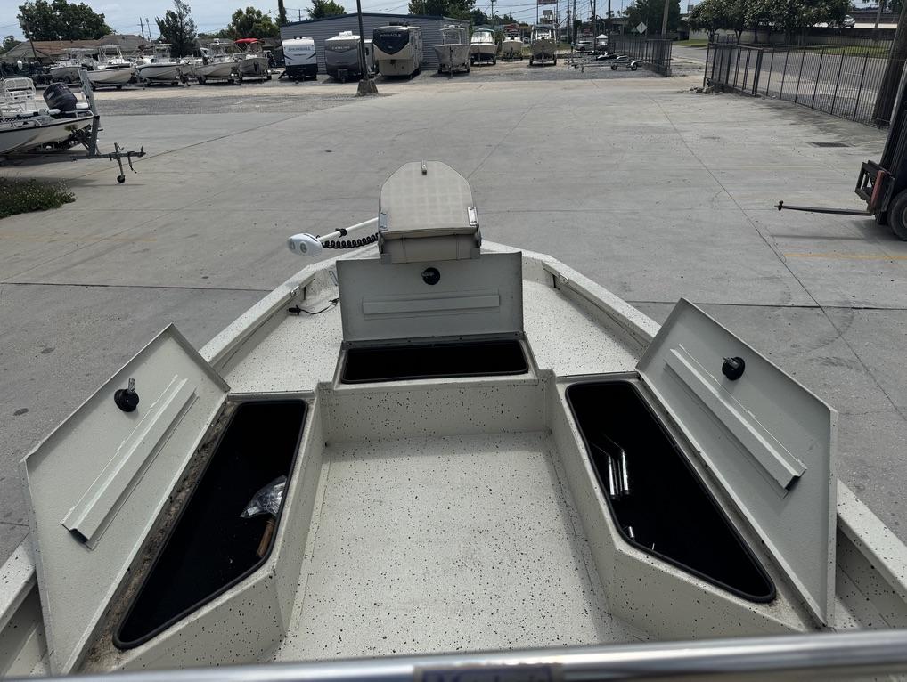 2013 Xpress Hyper-Lift Bay Series H22B boat with open storage compartments in a marina.