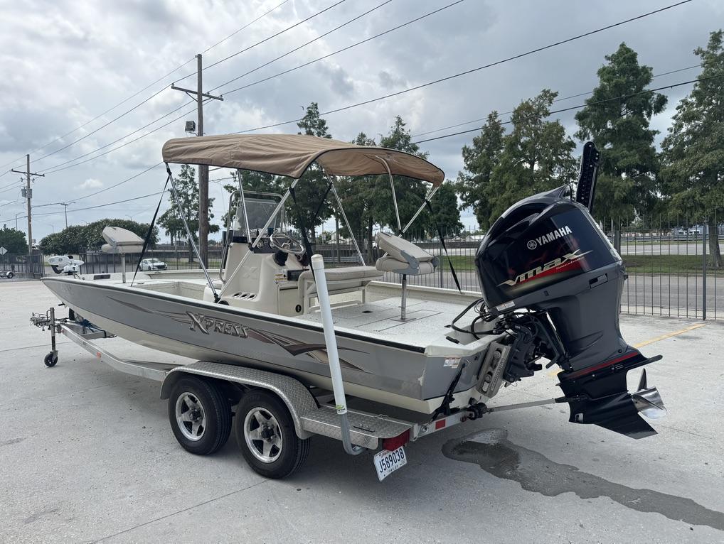 2013 Xpress Hyper-Lift Bay Series H22B boat with Yamaha VMAX engine on trailer.