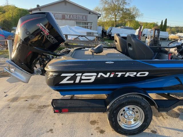 2024 Nitro Z19 boat with Mercury Pro XS engine at a marina.