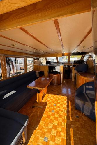 Interior of 1991 Ocean Alexander 46 yacht with wooden finishes and comfortable seating.