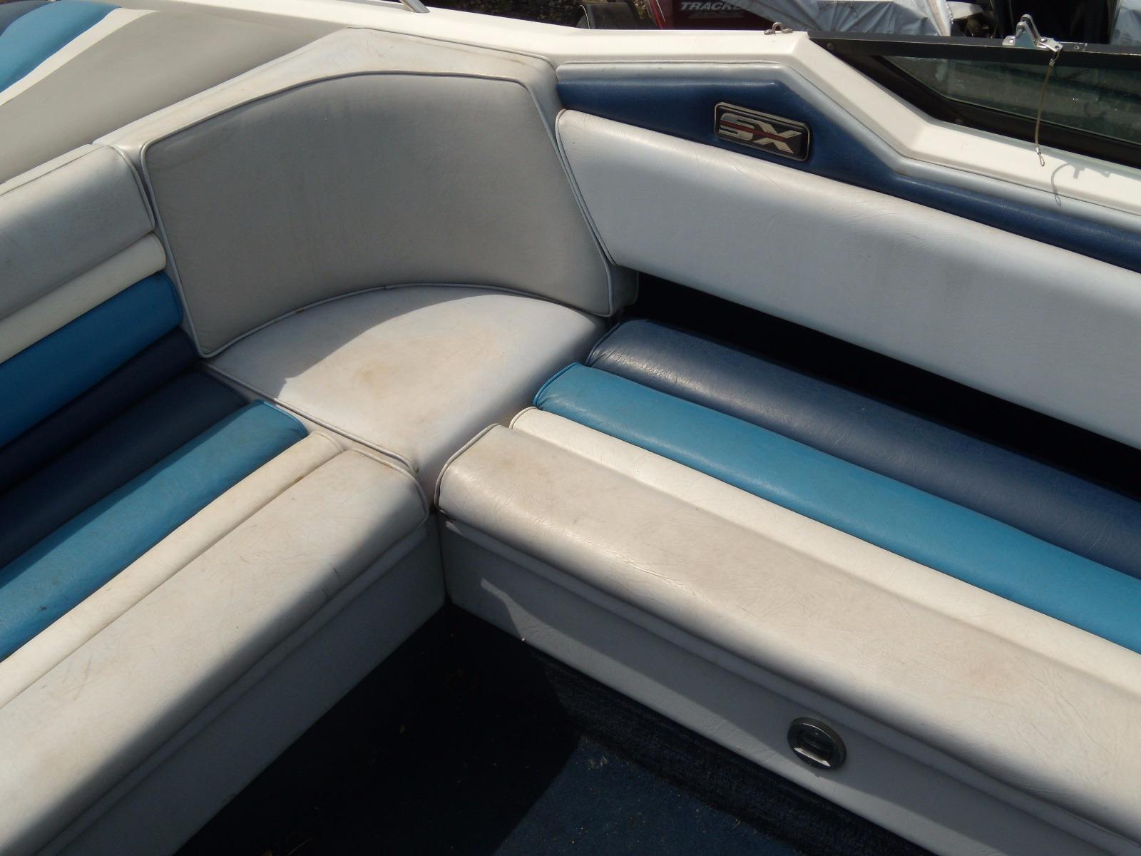 1989 Chaparral 2300 SX Sport boat interior with blue and white seating.