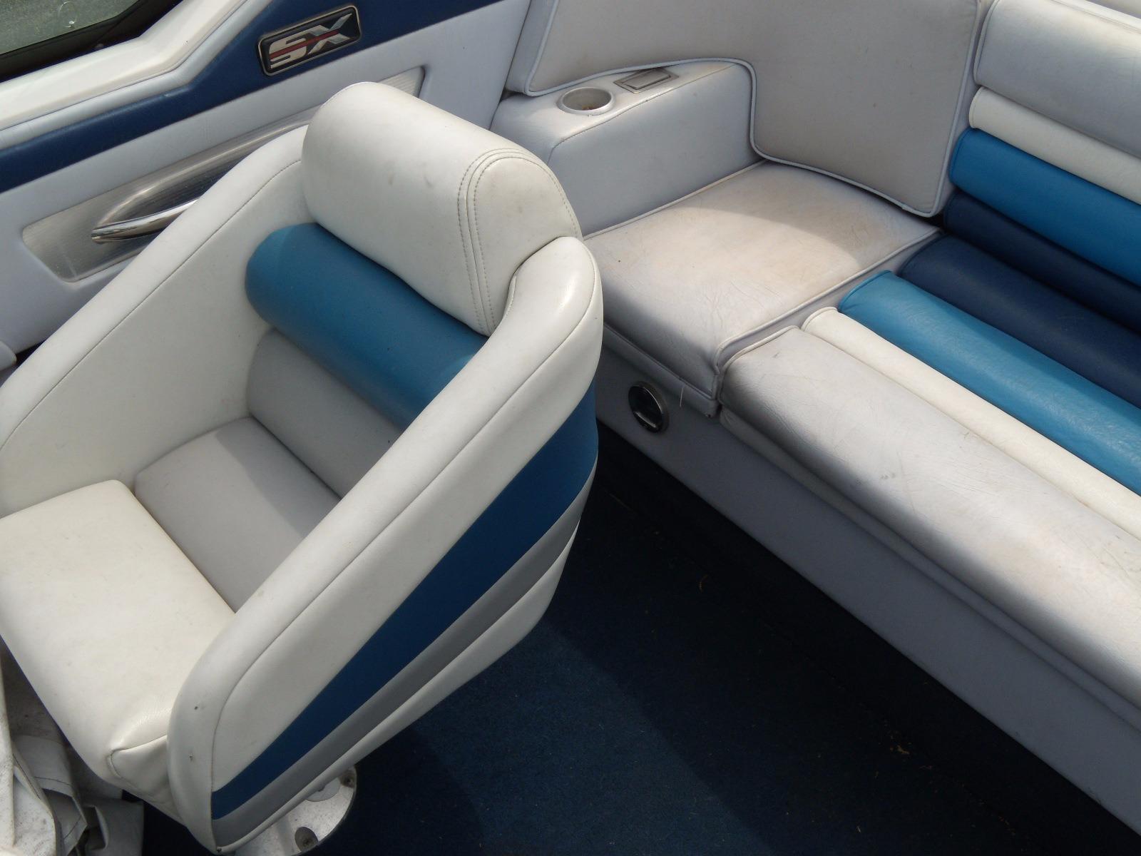 1989 Chaparral 2300 SX Sport boat interior with blue and white seating.