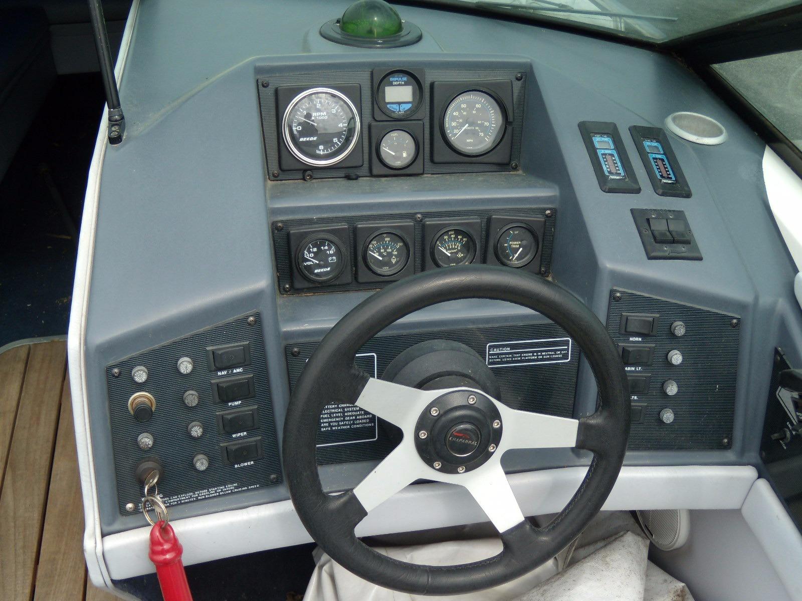 1989 Chaparral 2300 SX Sport dashboard with steering wheel and instrument gauges.
