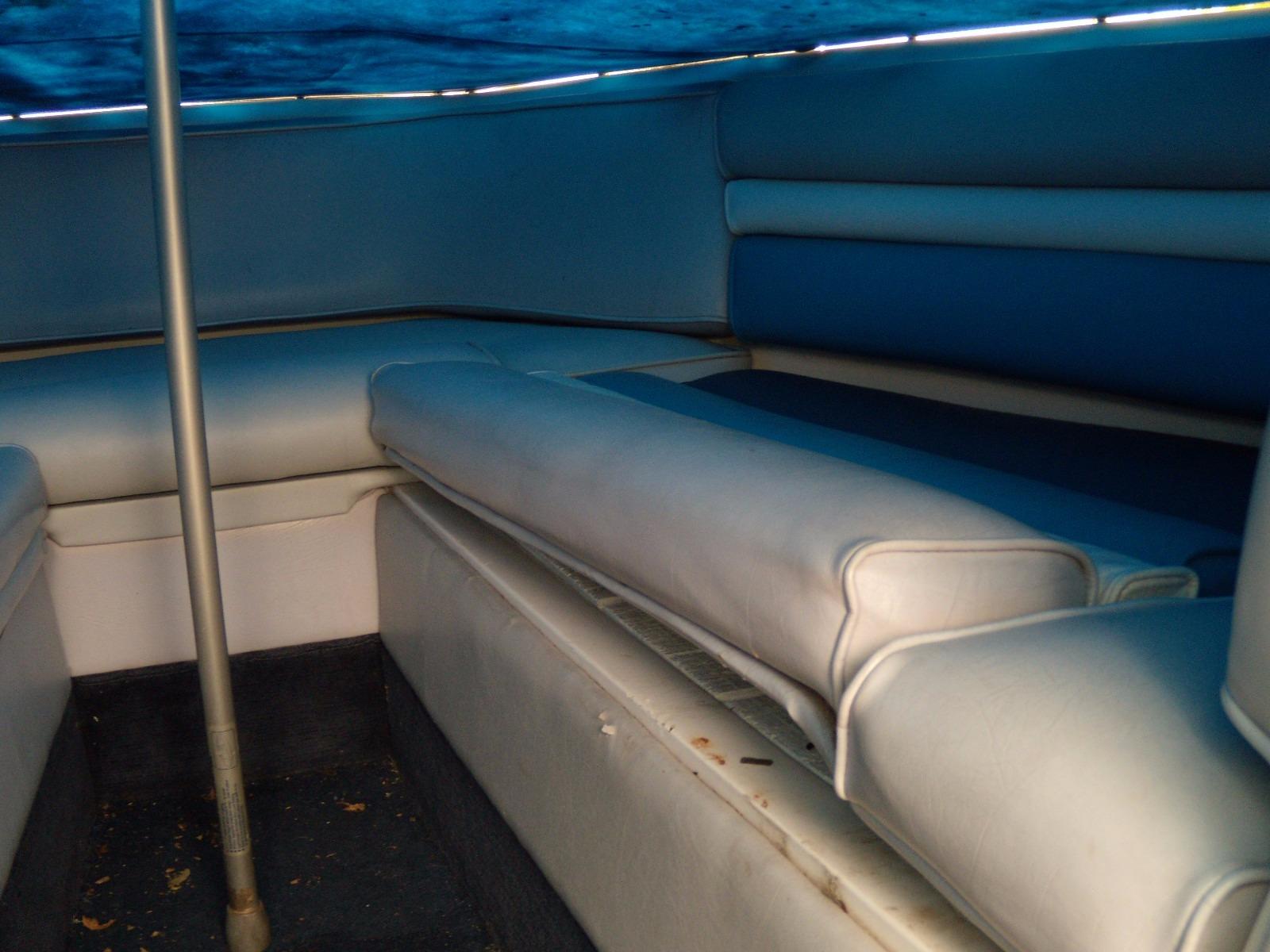Interior seating of 1989 Chaparral 2300 SX Sport boat, featuring blue upholstery.