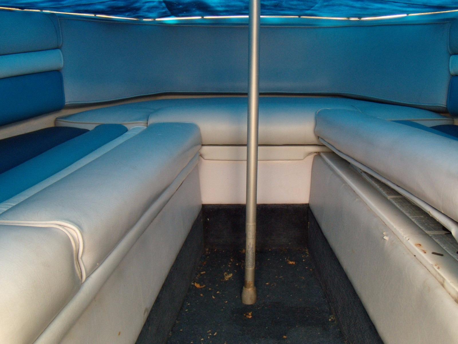 Interior of 1989 Chaparral 2300 SX Sport boat with blue and white seating.