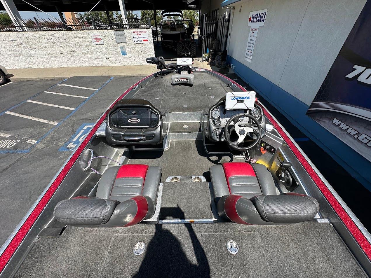 2013 Triton 19XS boat interior with dual seats and steering console.