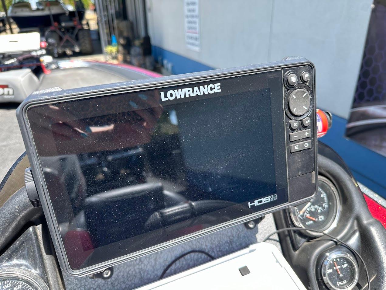 Lowrance HDS display on 2013 Triton 19XS boat dashboard, featuring navigation controls.