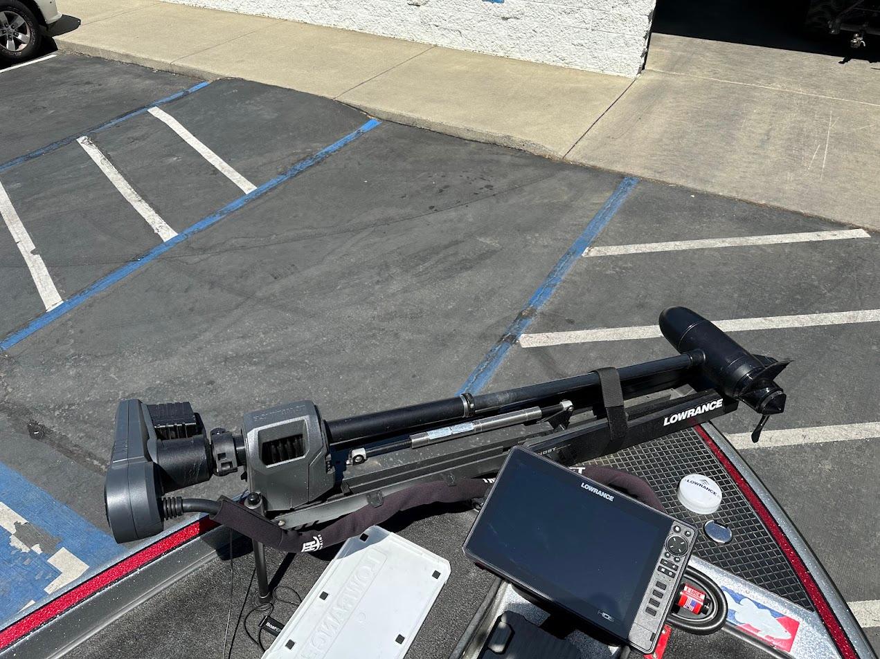 Triton 19XS 2013 boat with Lowrance equipment in a parking lot.