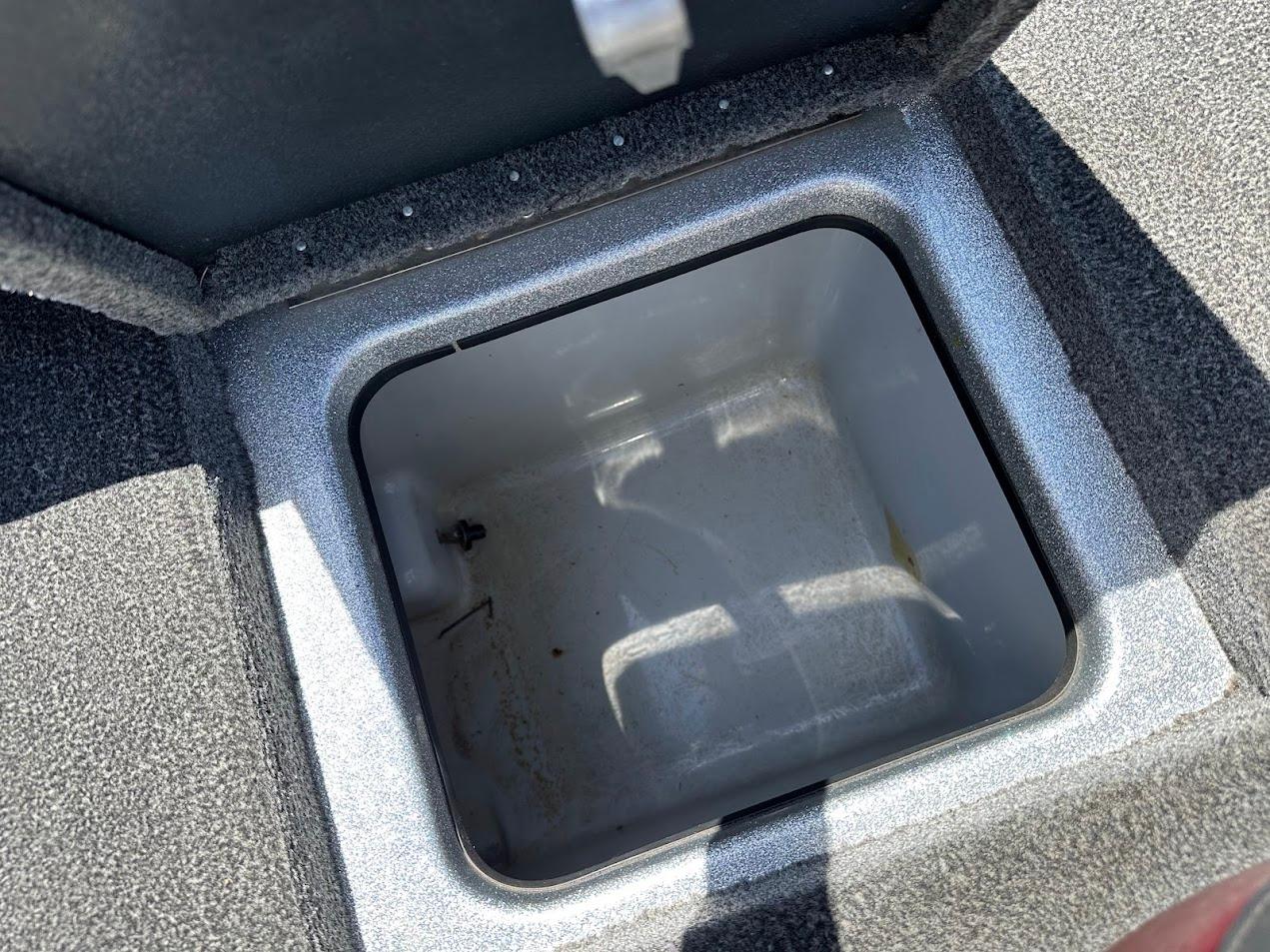 Open storage compartment in 2013 Triton 19XS boat.