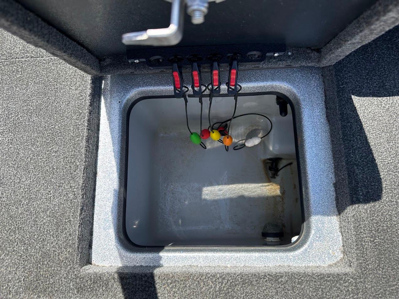 2013 Triton 19XS boat storage compartment with wiring and colorful connectors.