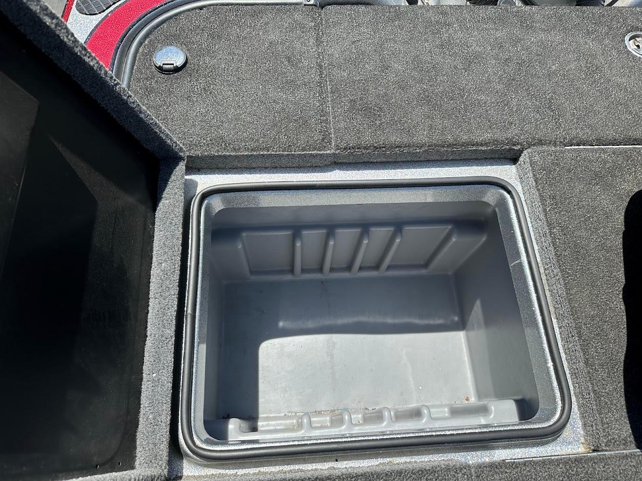 2013 Triton 19XS boat storage compartment with open lid, showcasing interior space.