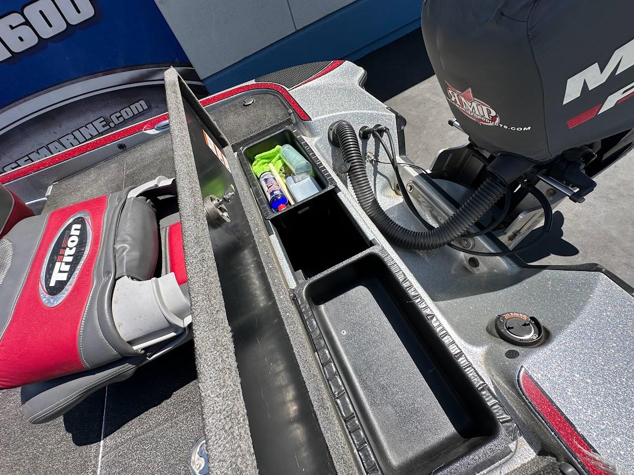 2013 Triton 19XS boat interior with storage compartments and Mercury engine.