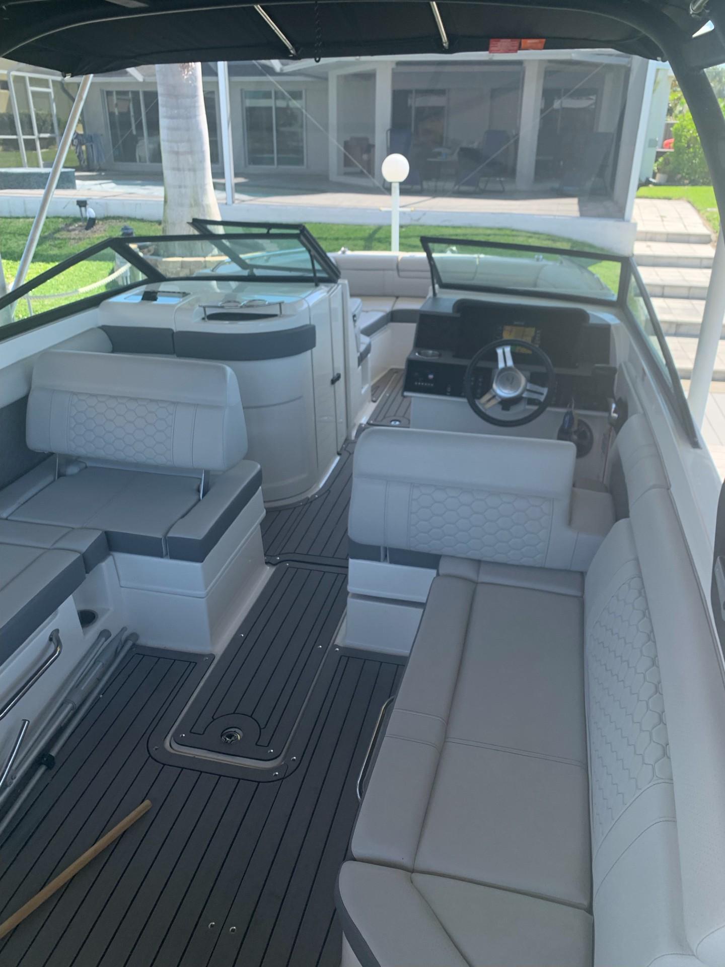 2021 Sea Ray SDX 270 Outboard boat interior with spacious seating and modern design.