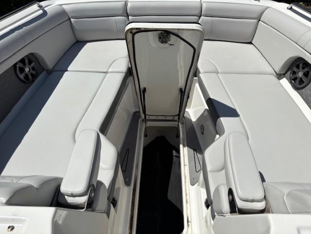 2021 Sea Ray SDX 270 Outboard boat interior with gray seating and storage compartment.