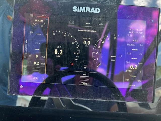 Simrad display on 2021 Sea Ray SDX 270 Outboard showing navigation and engine data.