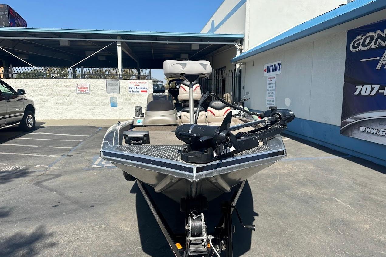 2001 Bass Tracker Pro Team 175 boat parked outside a dealership.