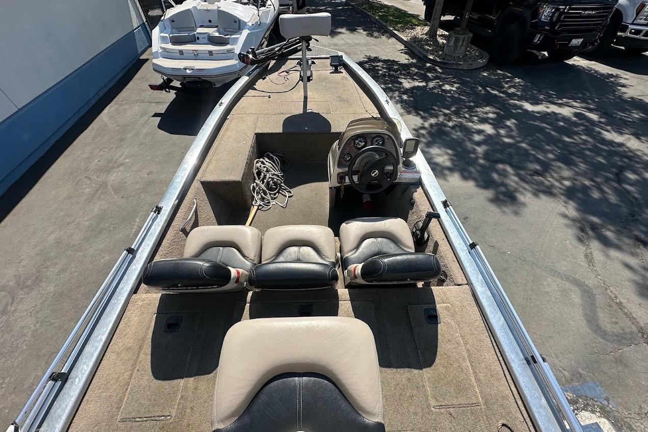 2001 Bass Tracker Pro Team 175 boat interior with steering console and seating.