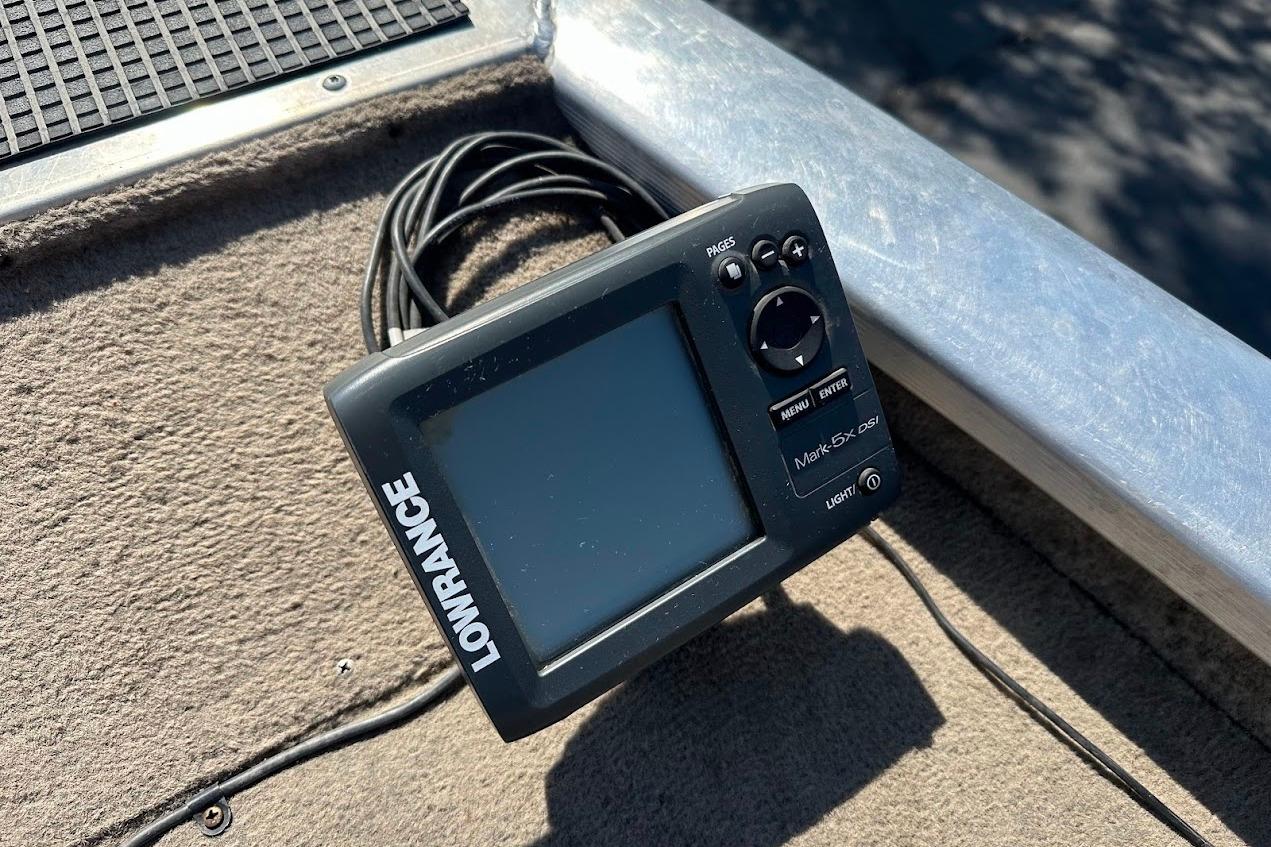 Lowrance fish finder on 2001 Bass Tracker Pro Team 175 boat deck.