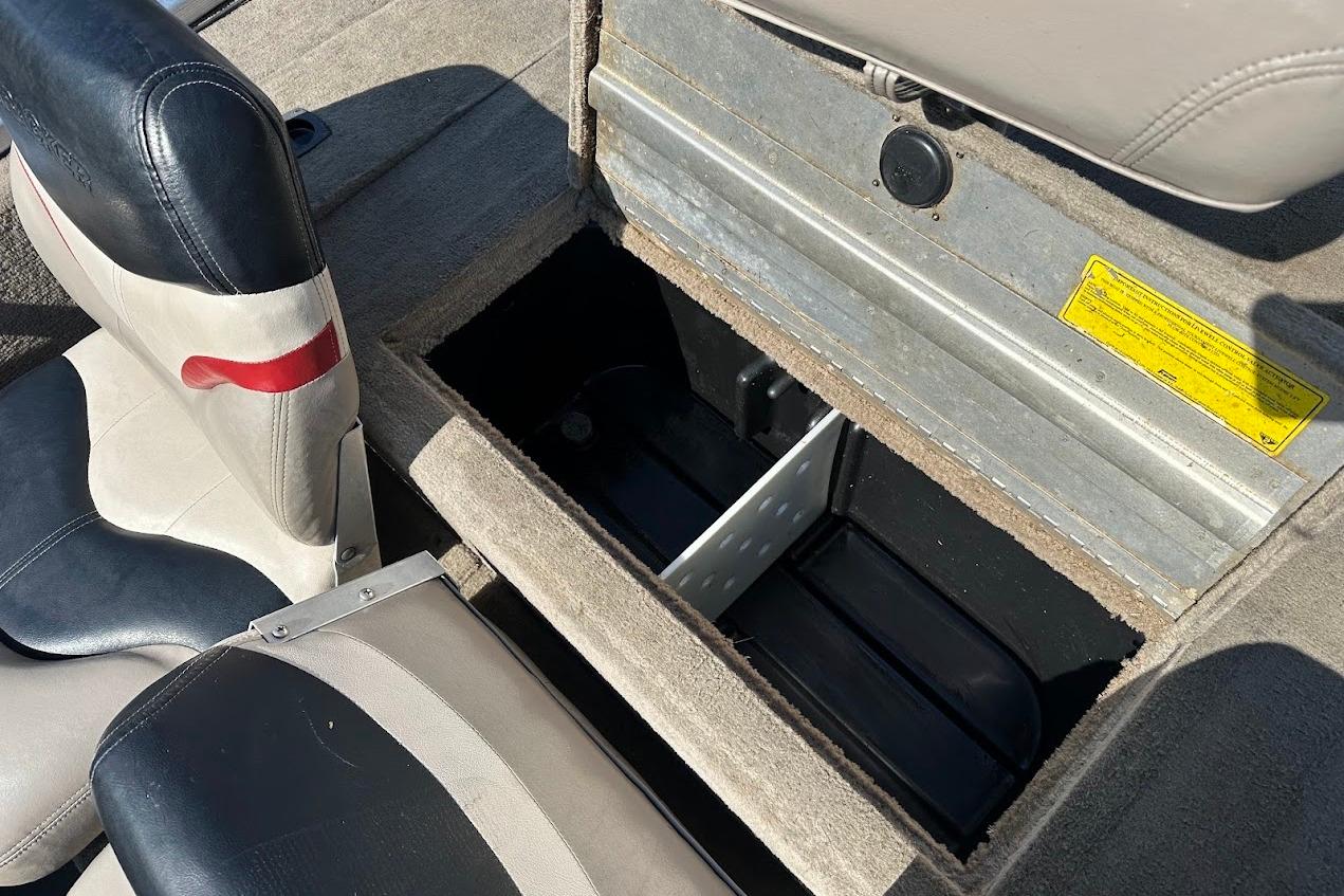 2001 Bass Tracker Pro Team 175 boat interior storage compartment with seats.
