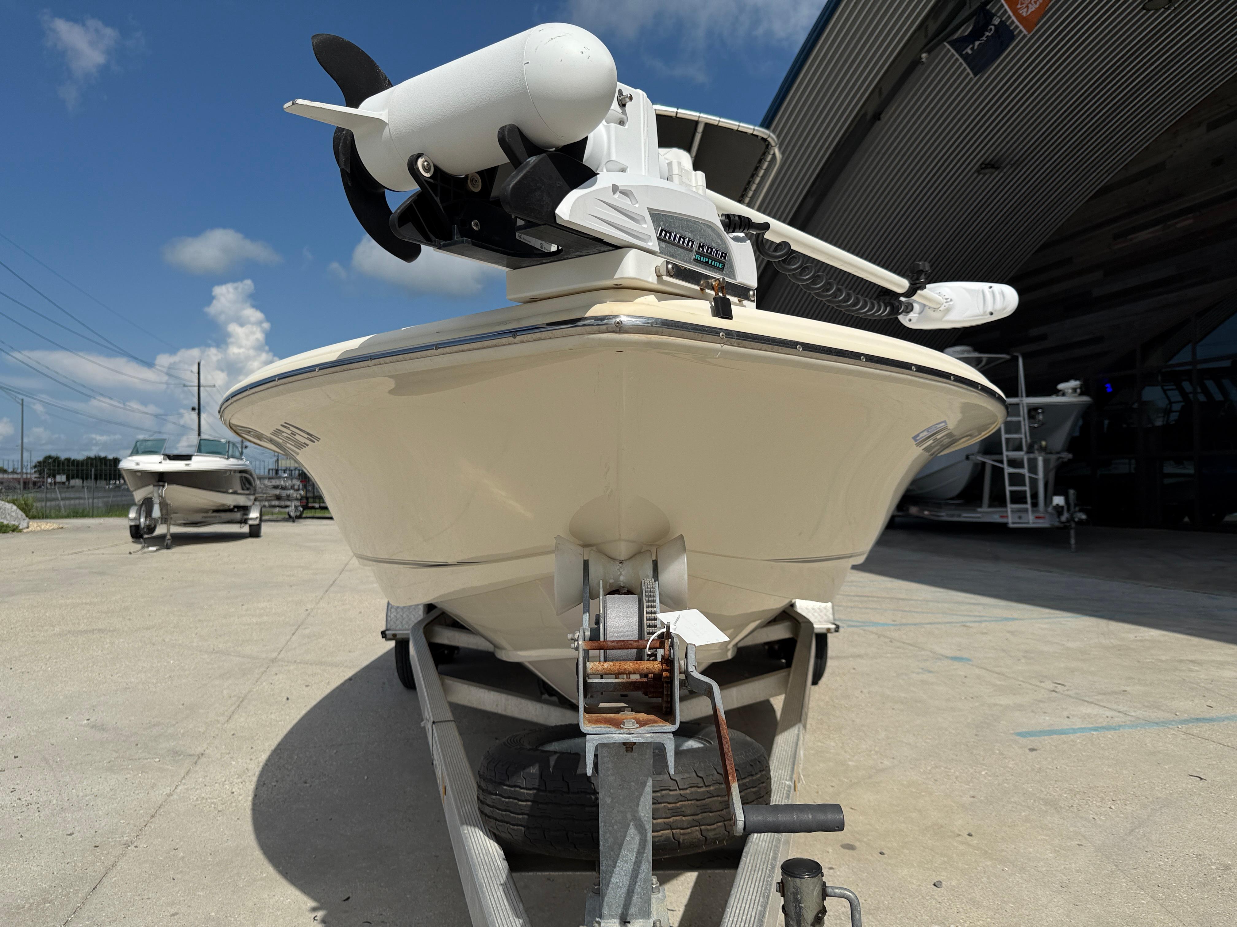 2014 Scout WINYAH BAY 221 boat on trailer, outdoor setting, clear sky.