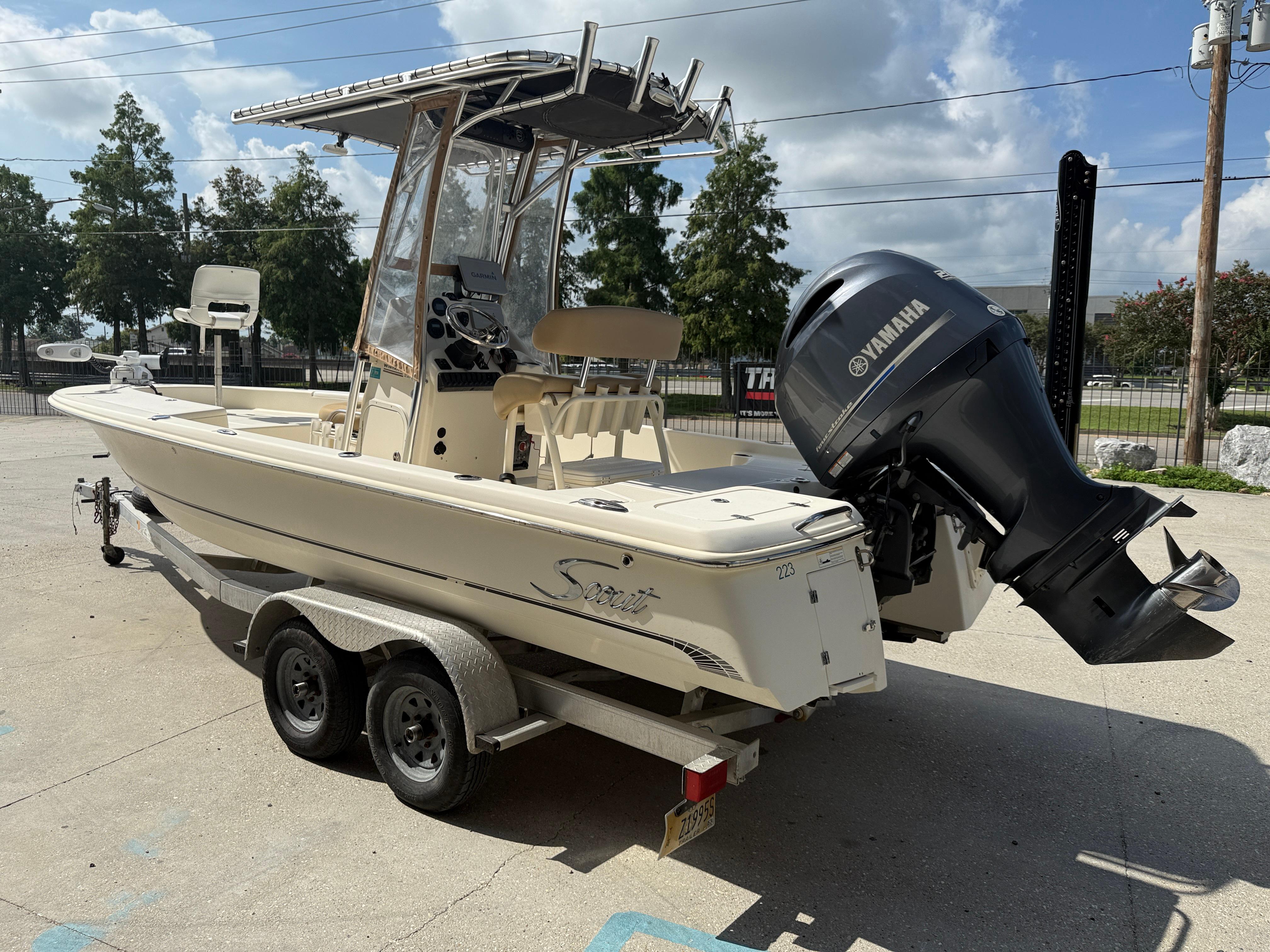 2014 Scout WINYAH BAY 221 boat on trailer with Yamaha outboard motor.