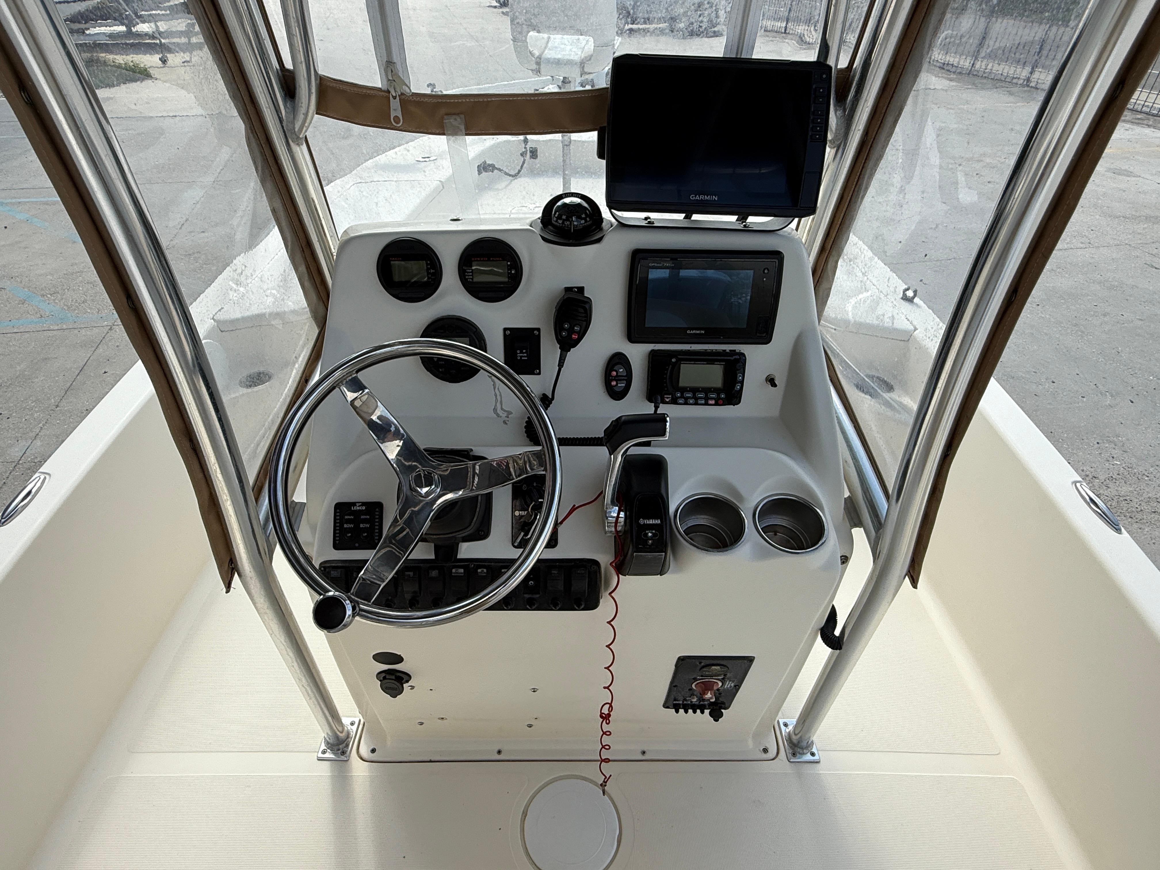 2014 Scout WINYAH BAY 221 boat console with steering wheel and navigation equipment.