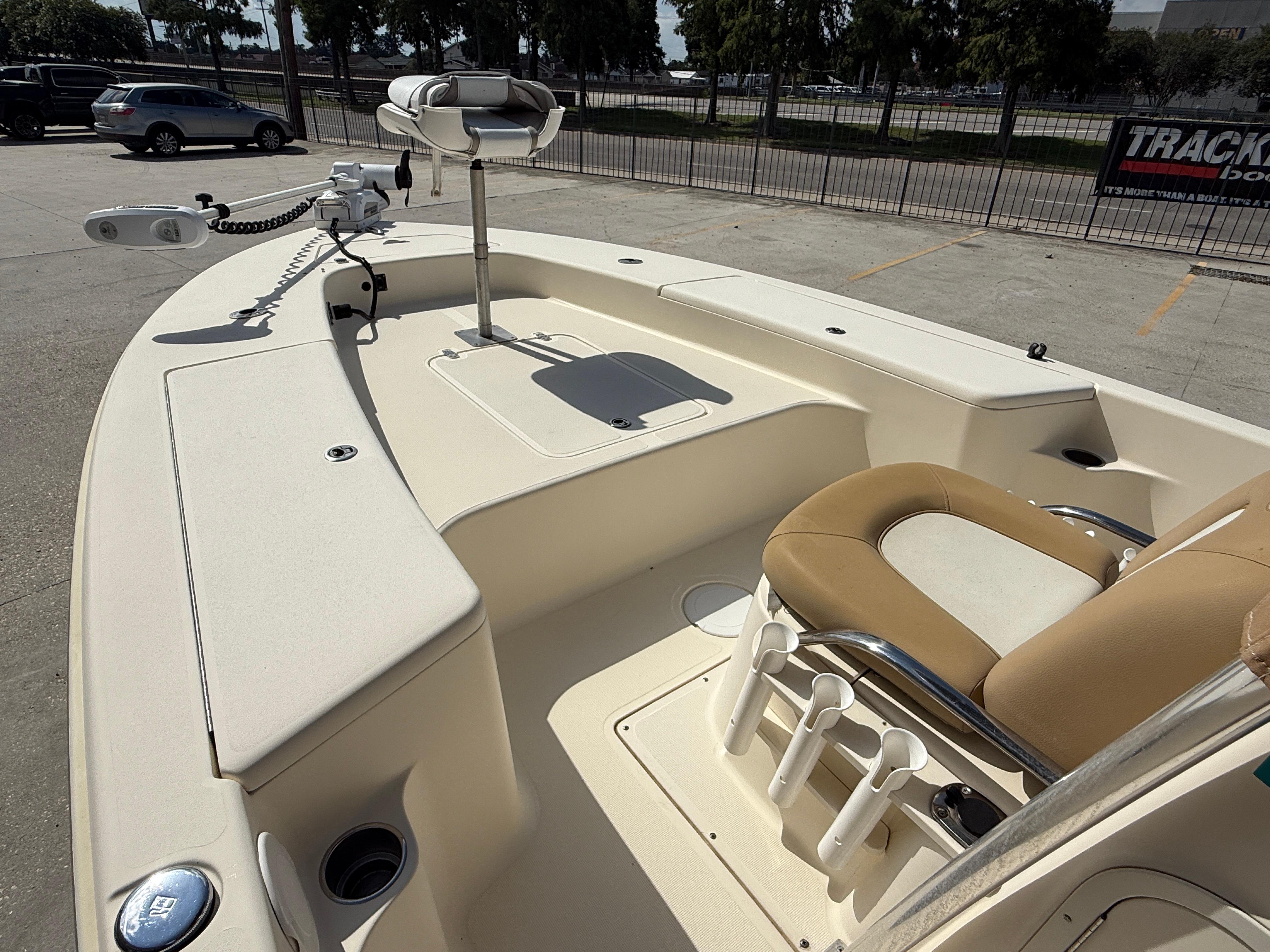 2014 Scout WINYAH BAY 221 boat interior with seating and fishing rod holders.
