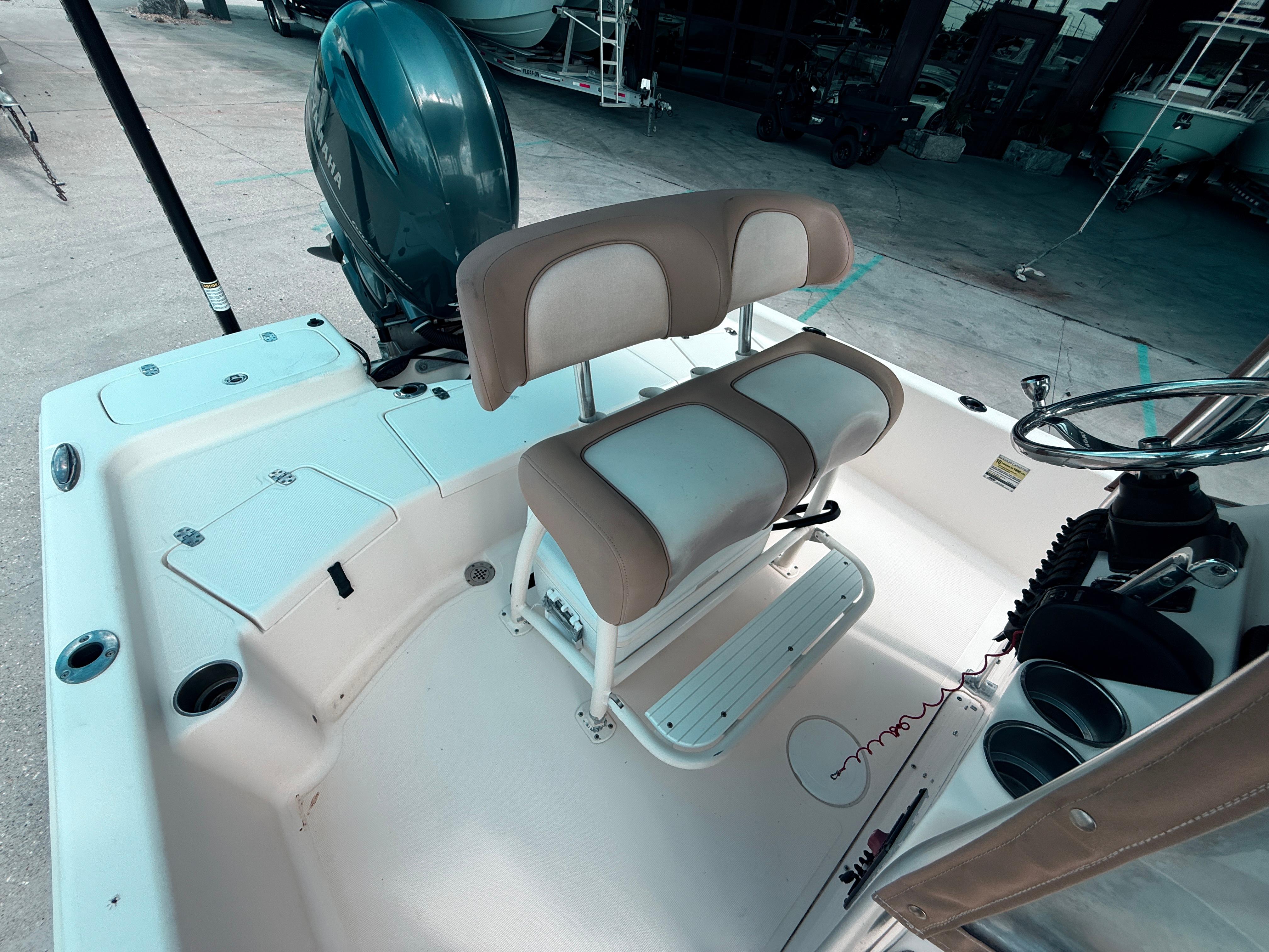 2014 Scout WINYAH BAY 221 boat interior with seating and Yamaha engine.