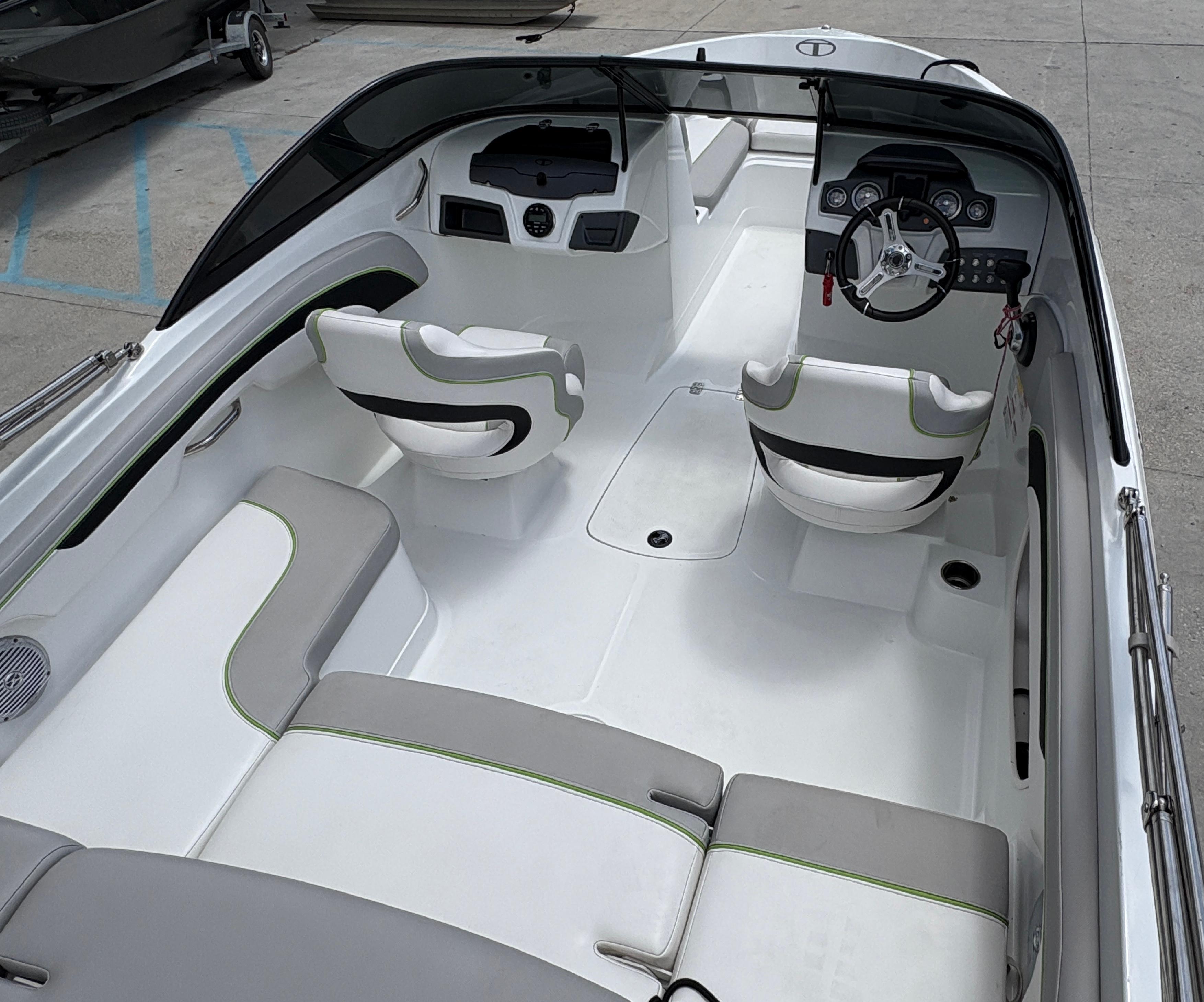 2019 Tahoe 700 boat interior with white seating and modern dashboard design.