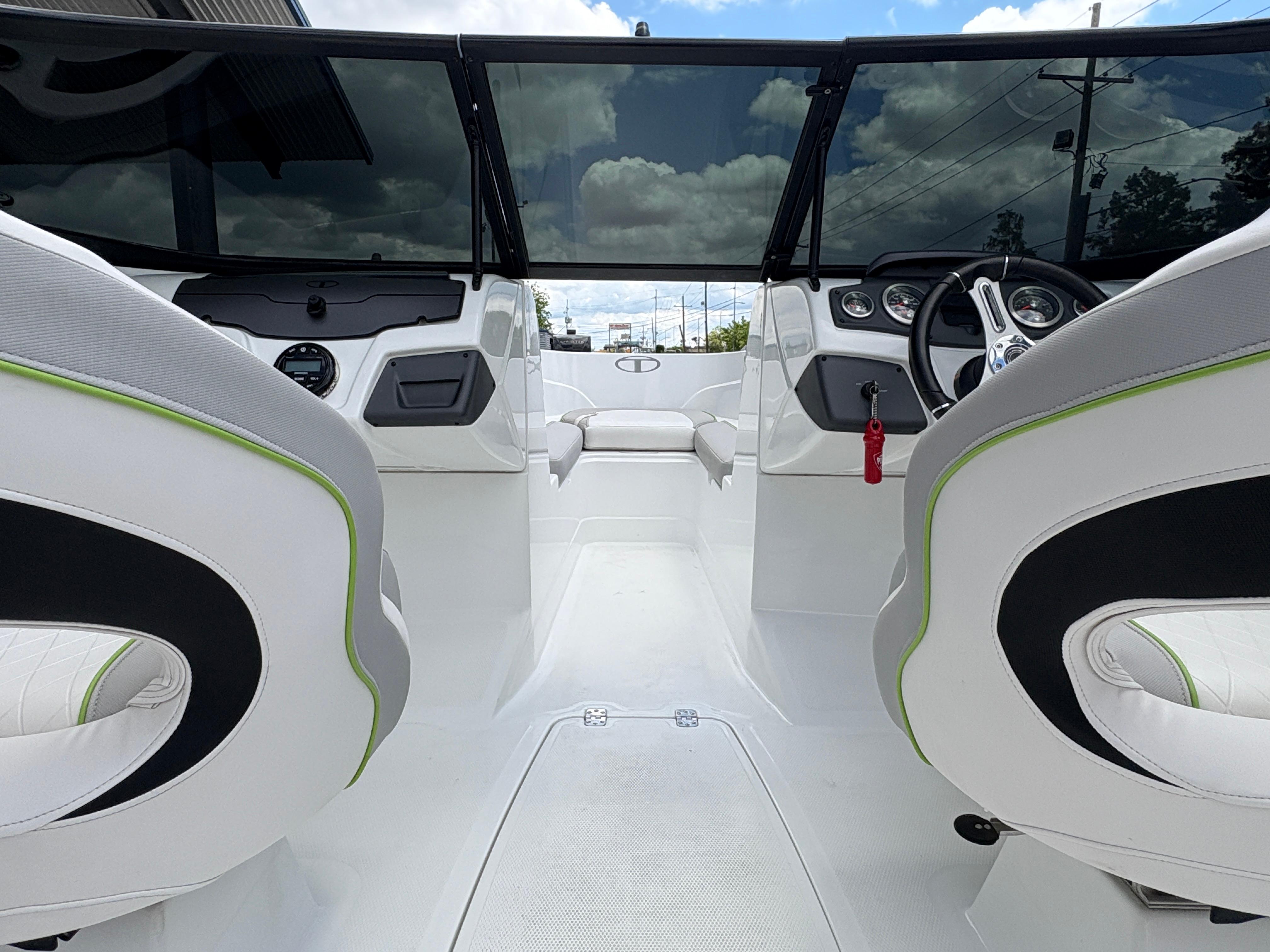 Interior view of 2019 Tahoe 700 boat with modern dashboard and seating.