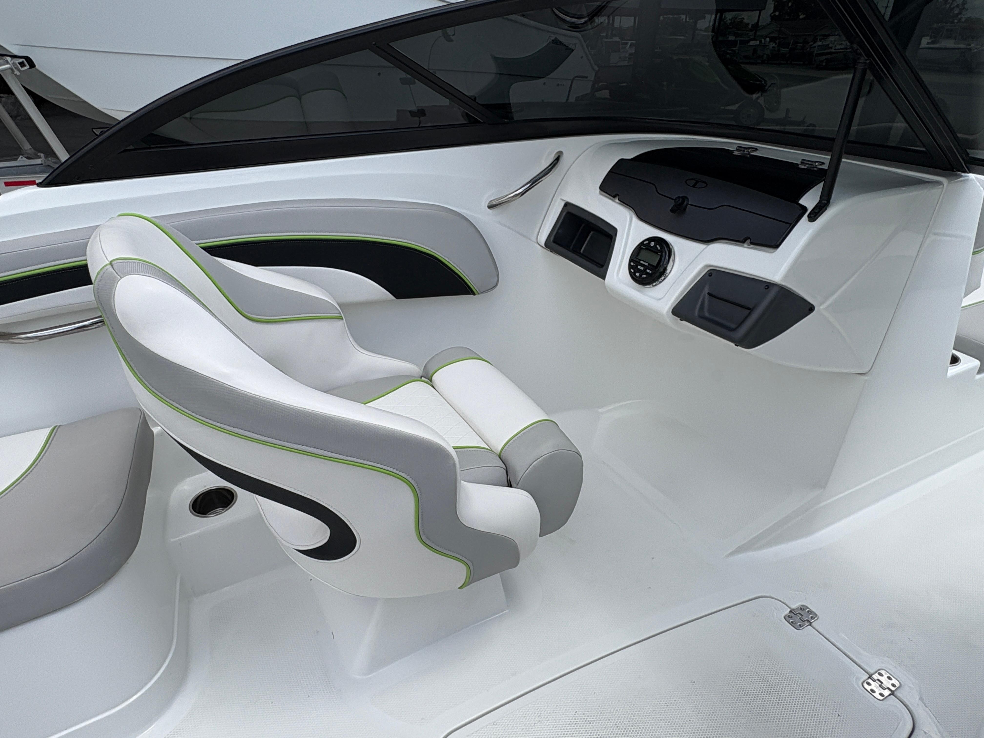 2019 Tahoe 700 boat interior with modern white and green seating and sleek dashboard design.