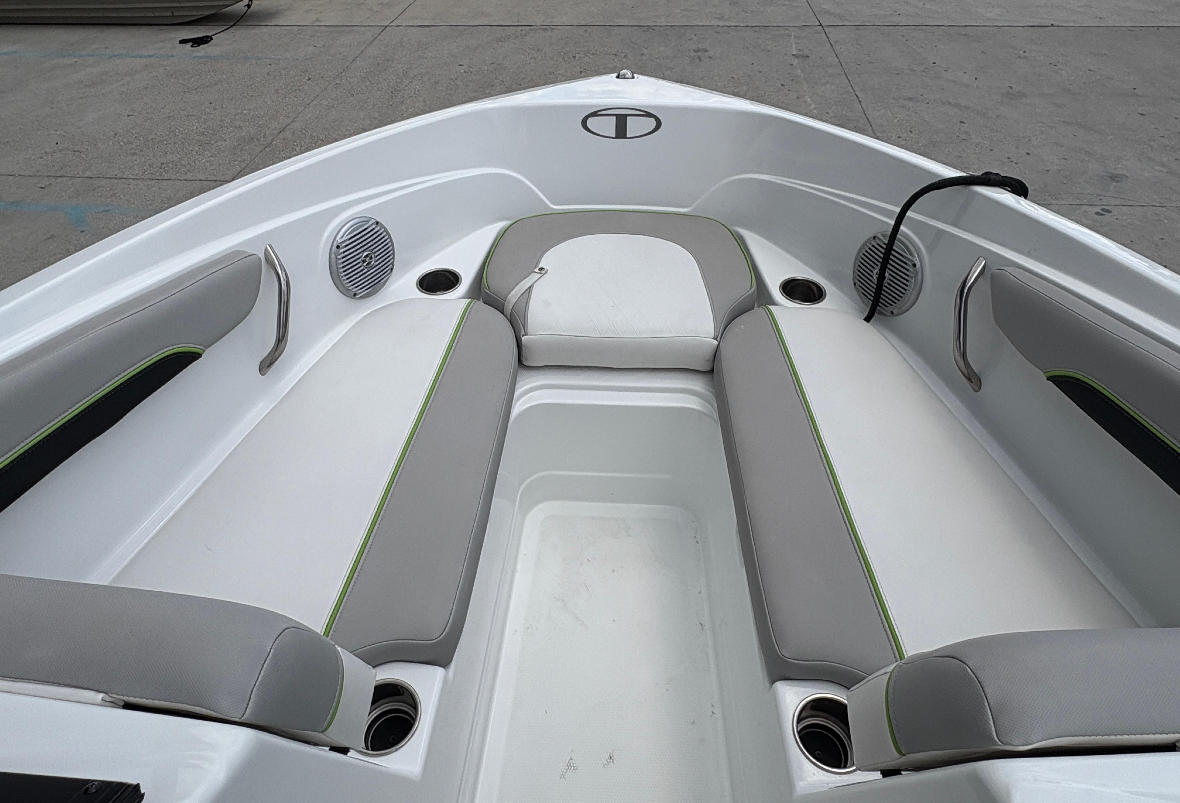 Bow seating area of 2019 Tahoe 700 boat with gray and white upholstery.
