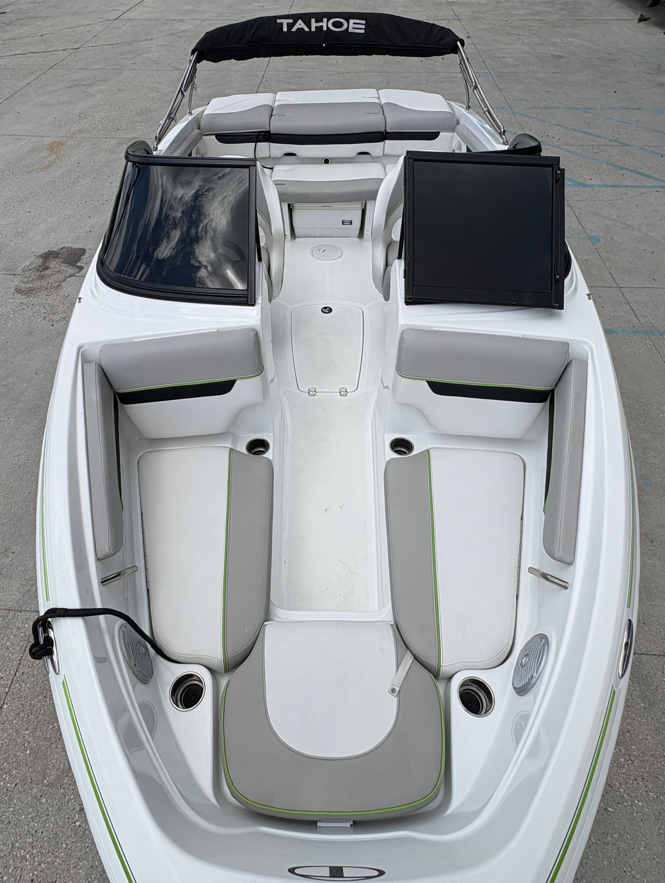 2019 Tahoe 700 boat interior with white and gray seating, black accents, and open deck layout.