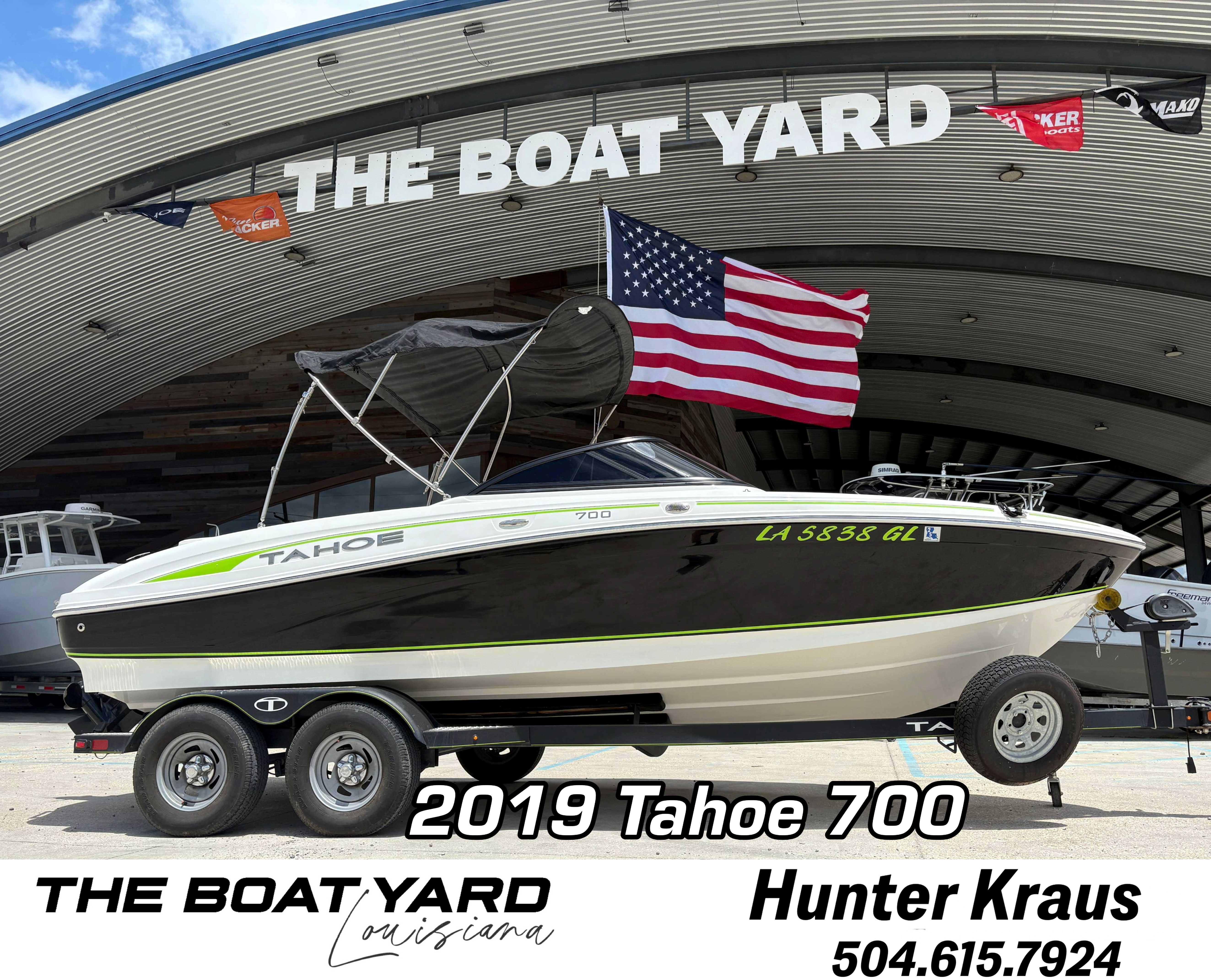 2019 Tahoe 700 boat displayed at The Boat Yard, Louisiana, with American flag.